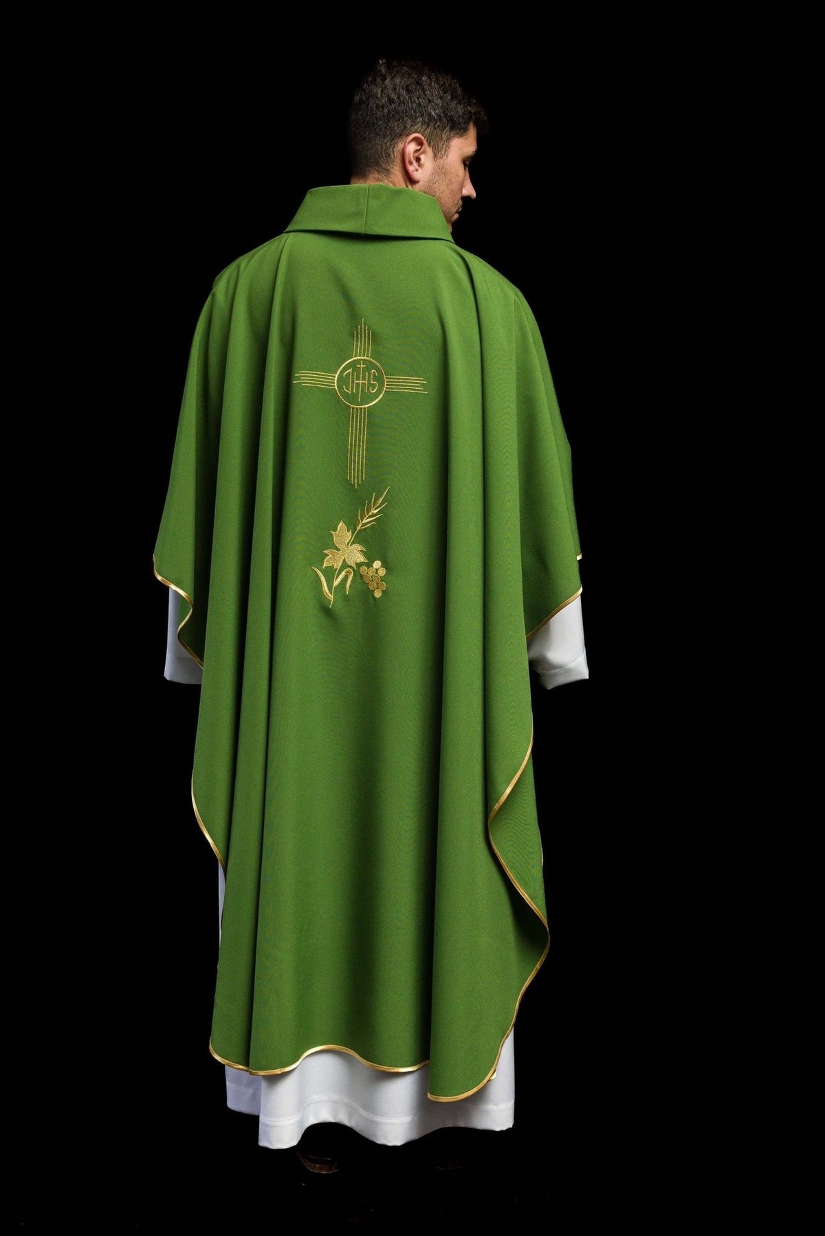 Green chasuble back view with gold IHS embroidery and floral motif