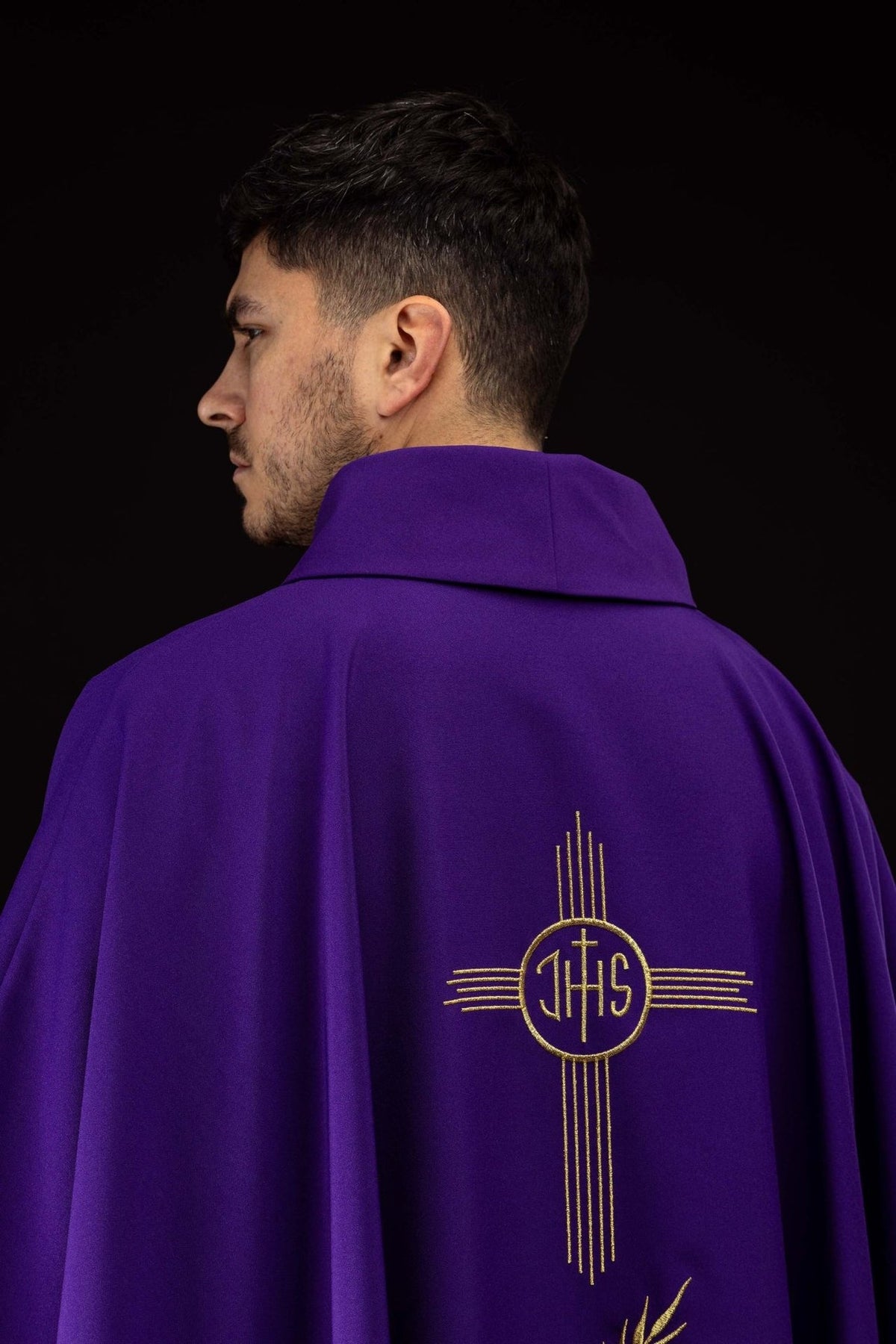 Purple chasuble back close-up with gold IHS embroidery