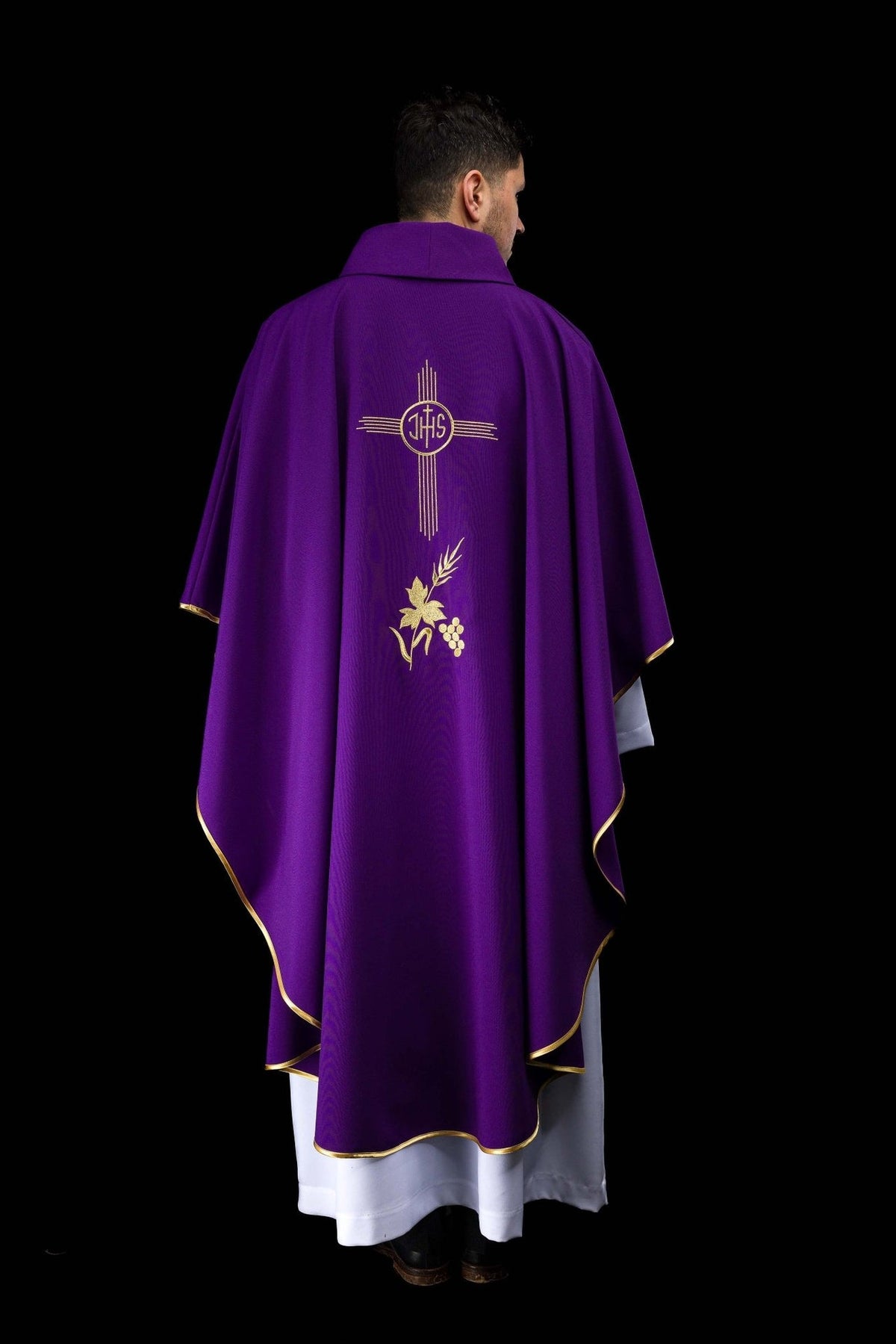 Purple chasuble back view with IHS and floral embroidery