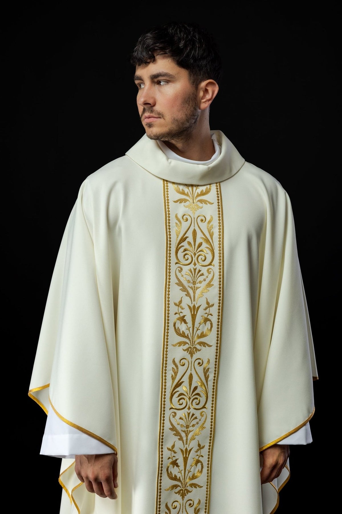 Ecru chasuble front view showing the stand-up collar, embroidered orphrey and gold trim