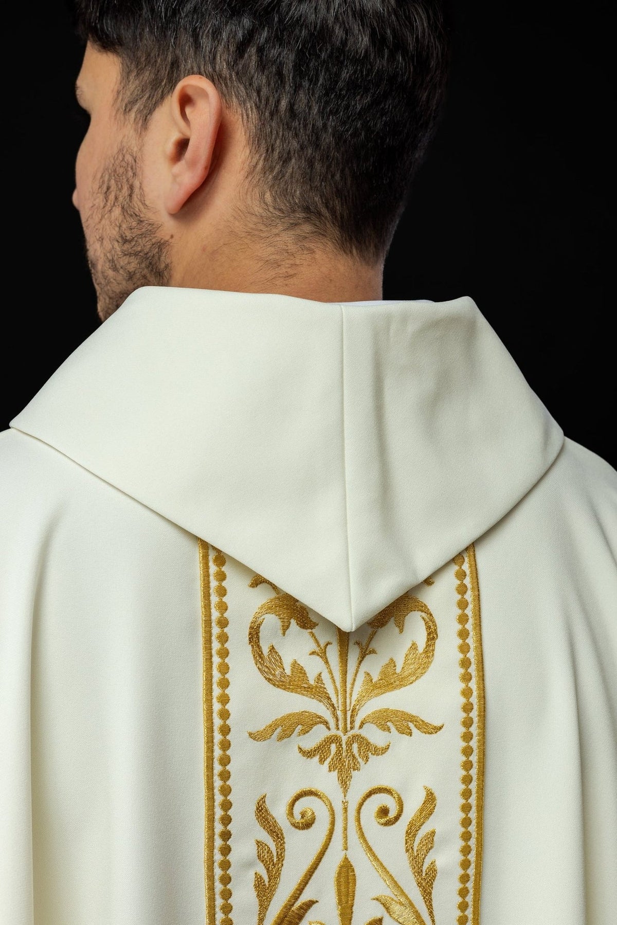 Ecru chasuble back close-up with stand-up collar and gold embroidered orphrey