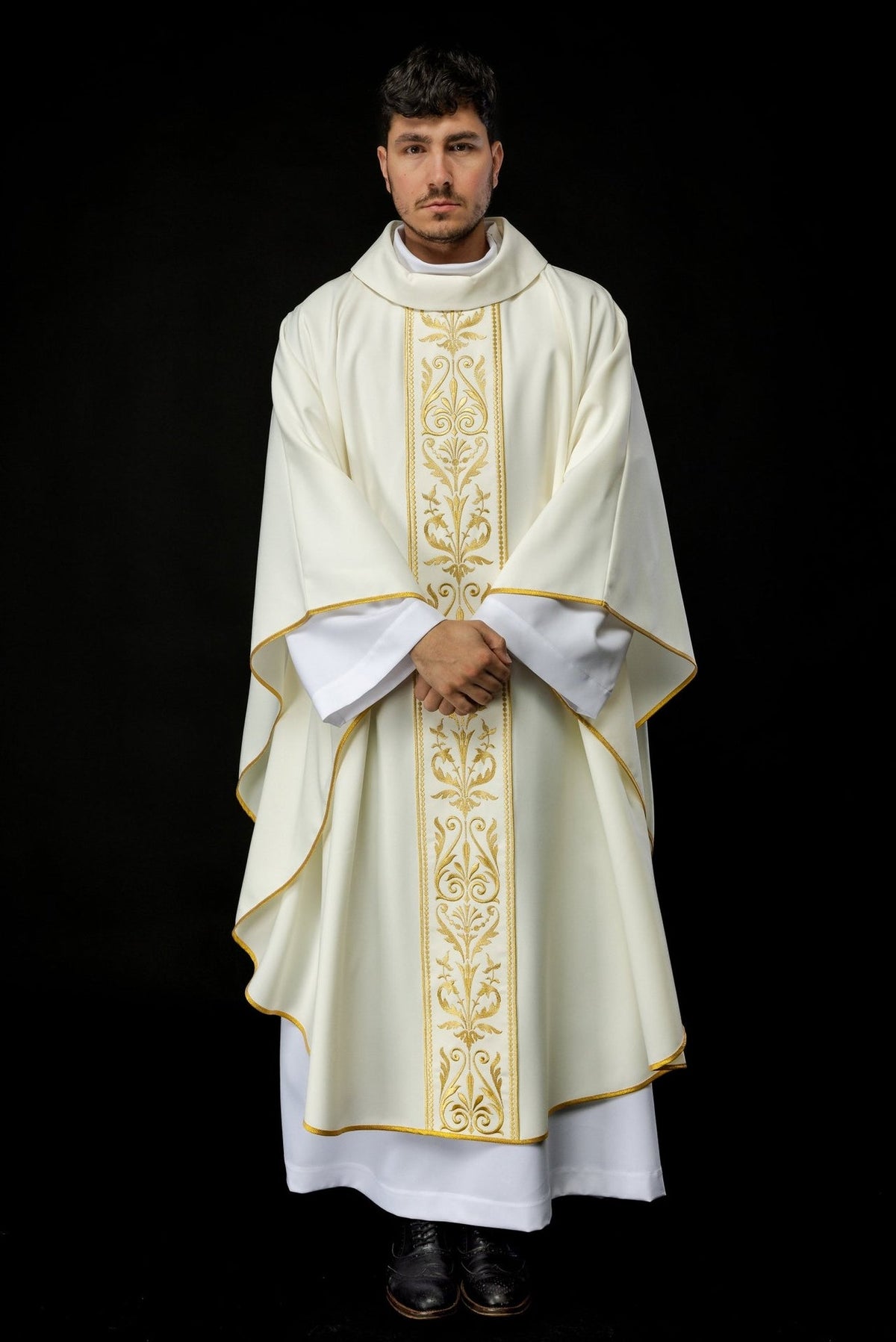 Ecru chasuble front view with stand-up collar, gold floral orphrey and trimmed sleeves