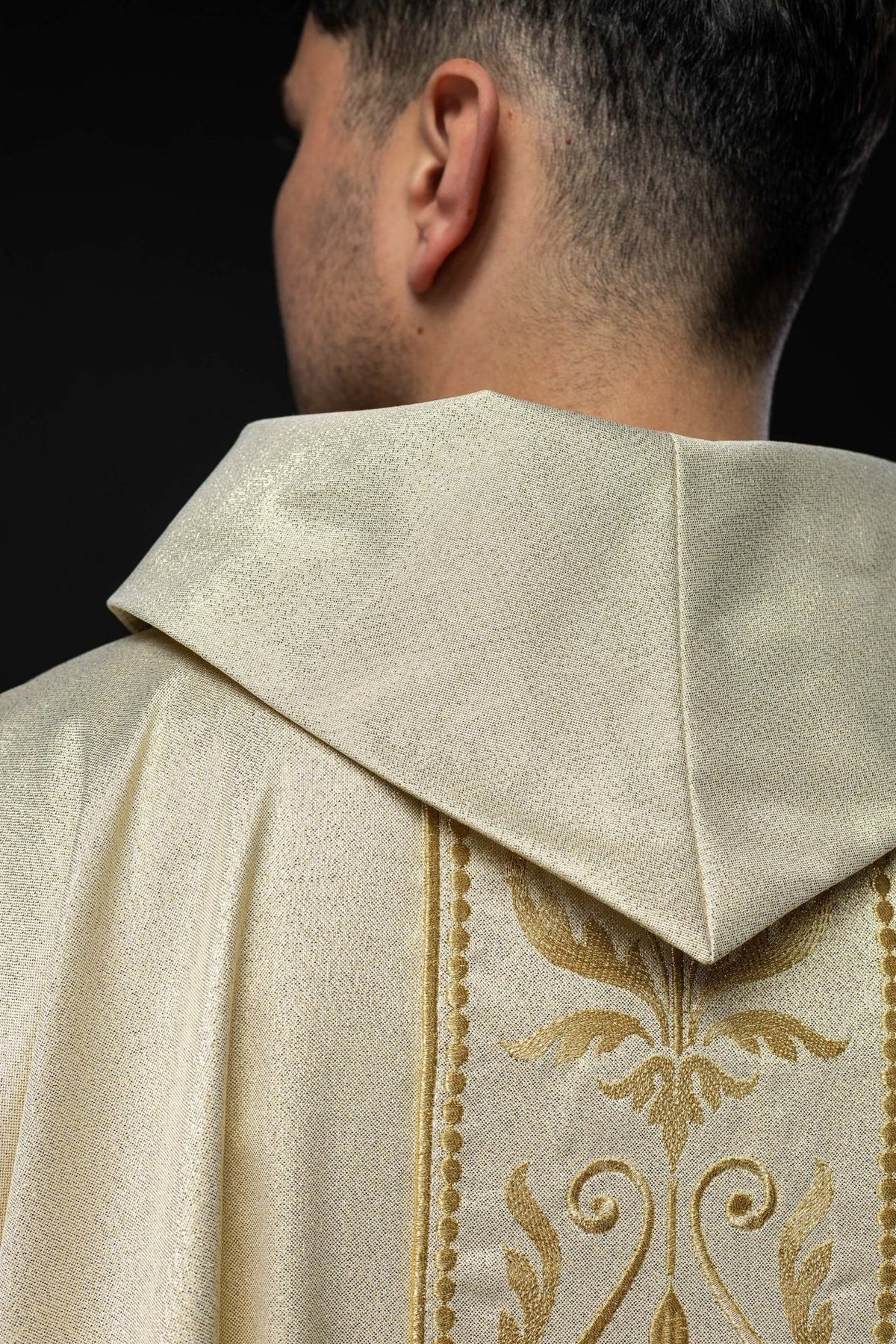 Liturgical chasuble, close-up of lower front orphrey with gold floral embroidery