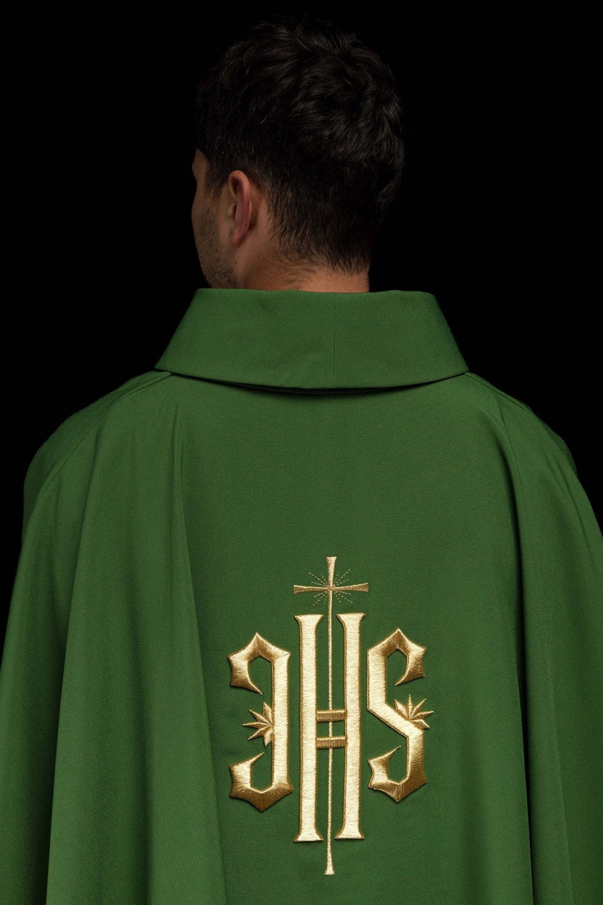 Green chasuble back view with gold IHS embroidery