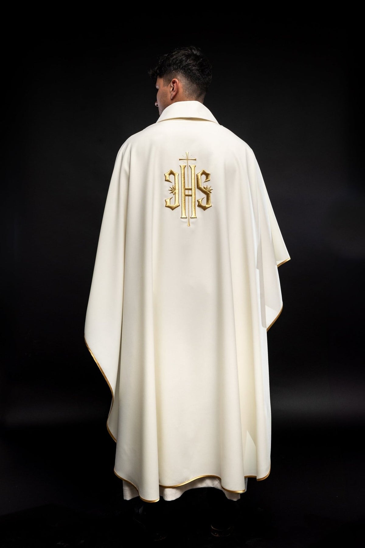 Ecru chasuble back view with gold IHS embroidery and gold trim