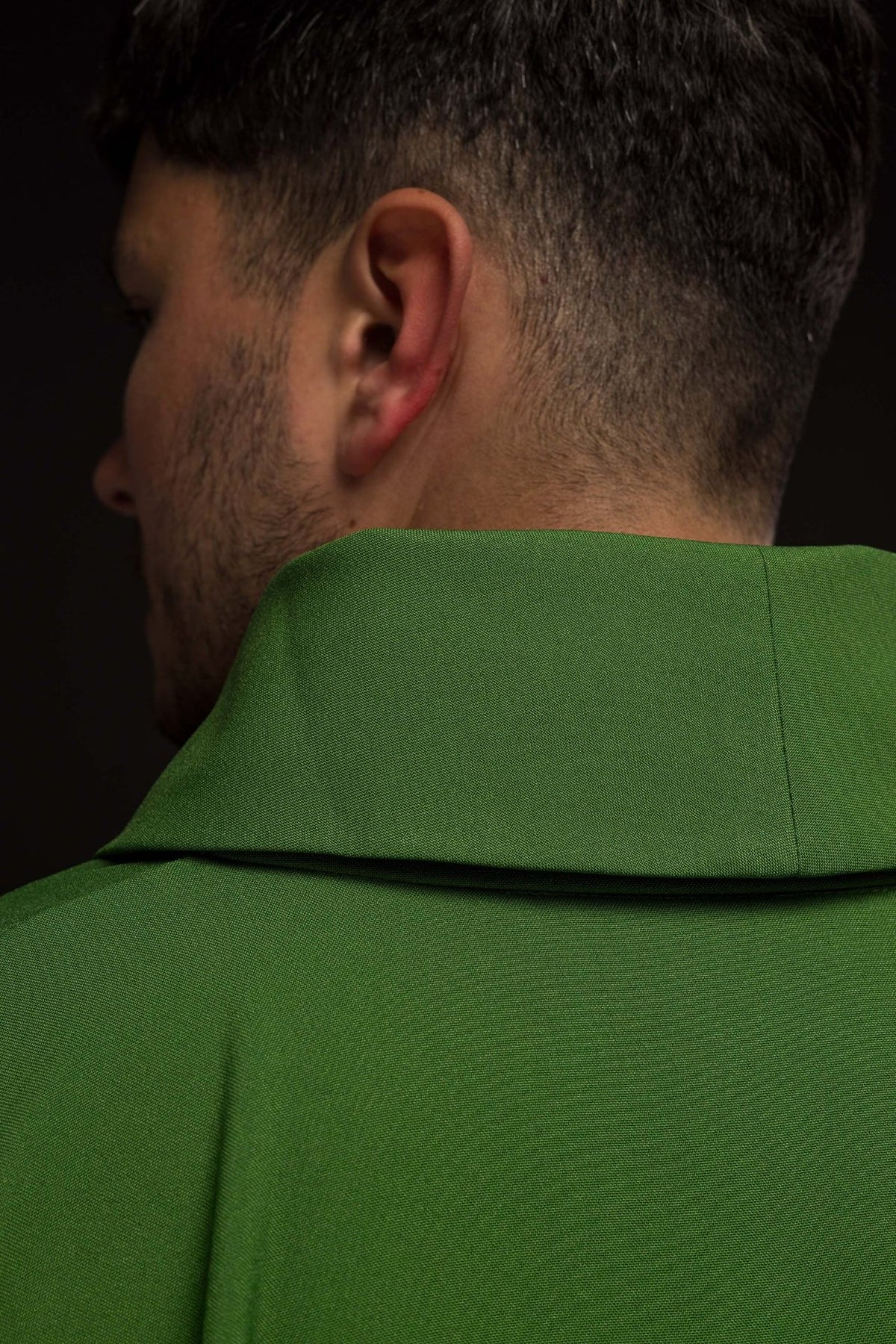 Product label and fabric detail for the Green Chasuble with Cross and Wheat Embroidery