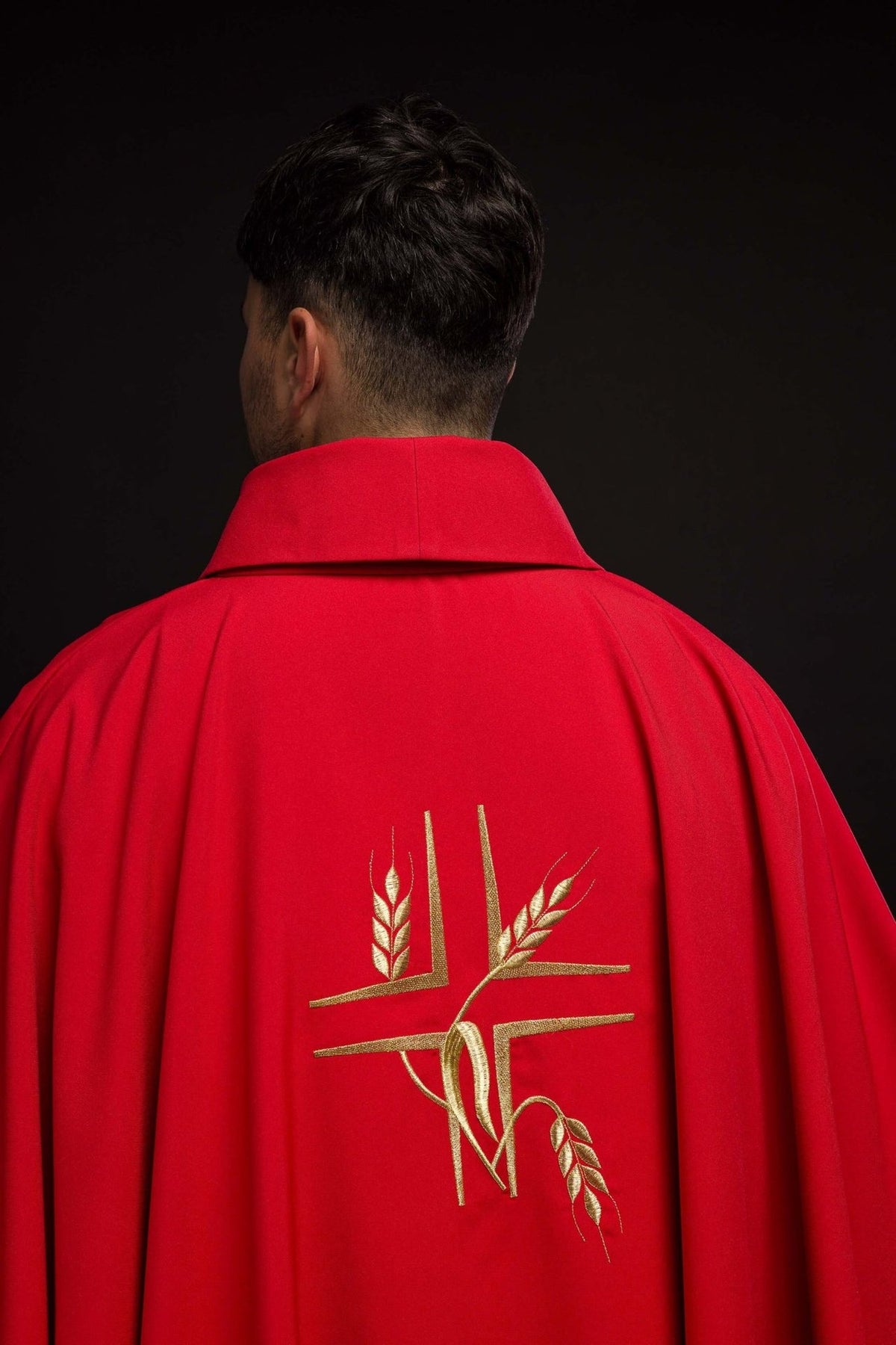 Red chasuble side close-up showing stand-up collar and back fabric