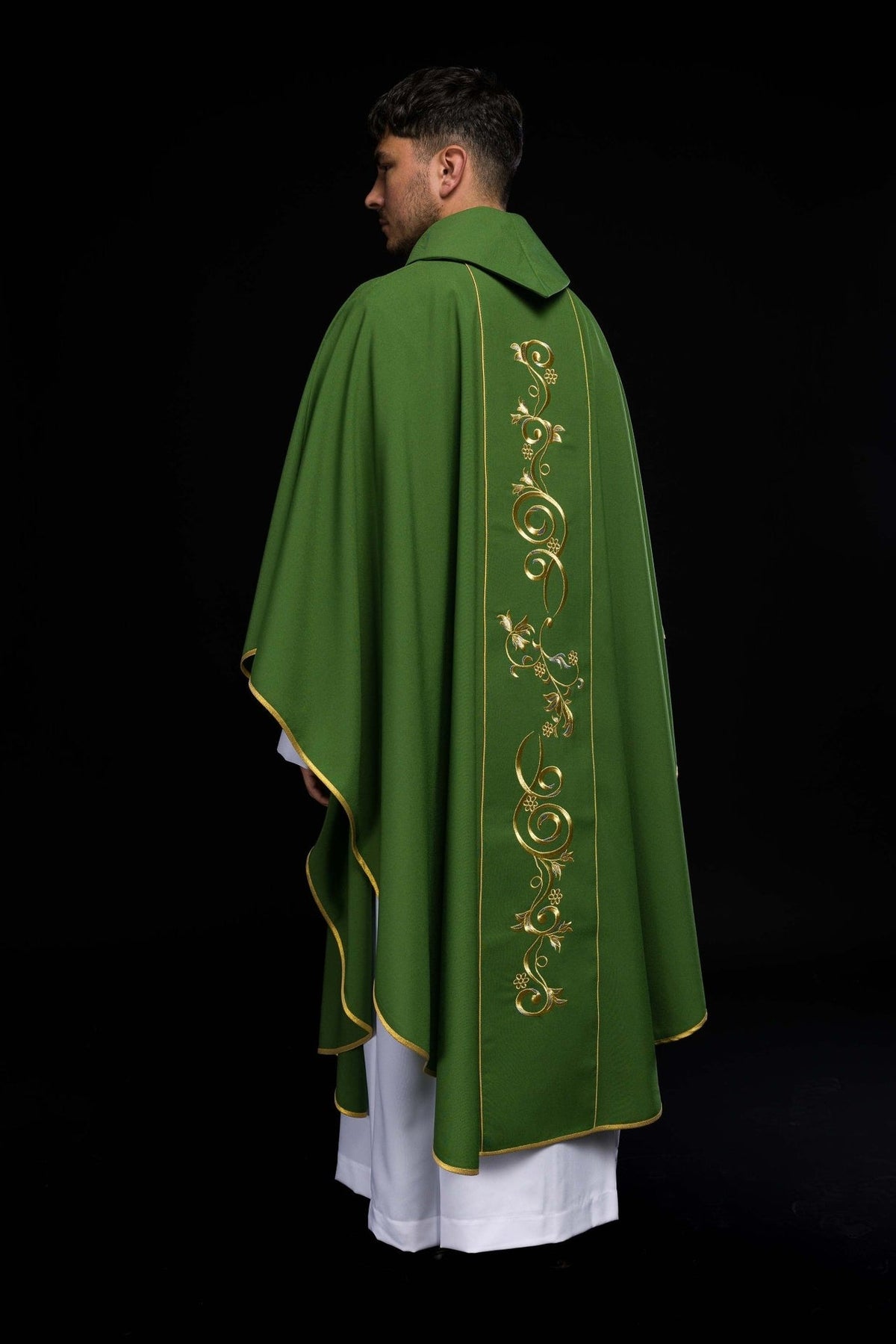 Green chasuble side view with gold-trimmed edges and back embroidery