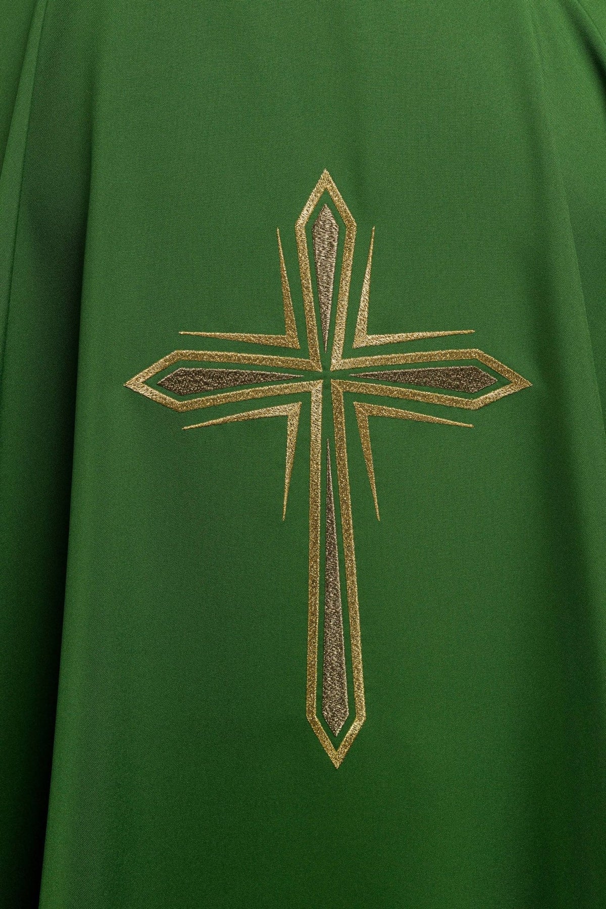 Green chasuble close-up of gold cross embroidery on the back