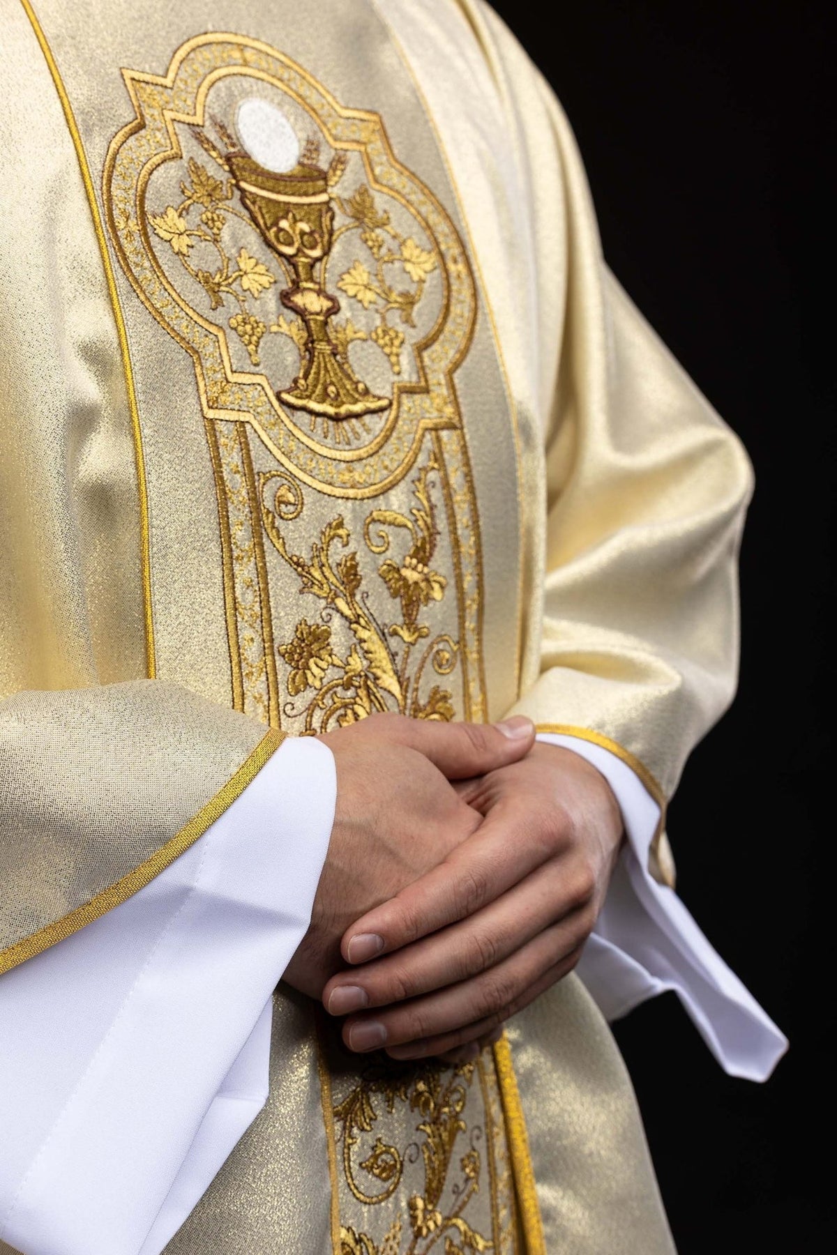 Gold chasuble close-up of floral embroidery on the central orphrey