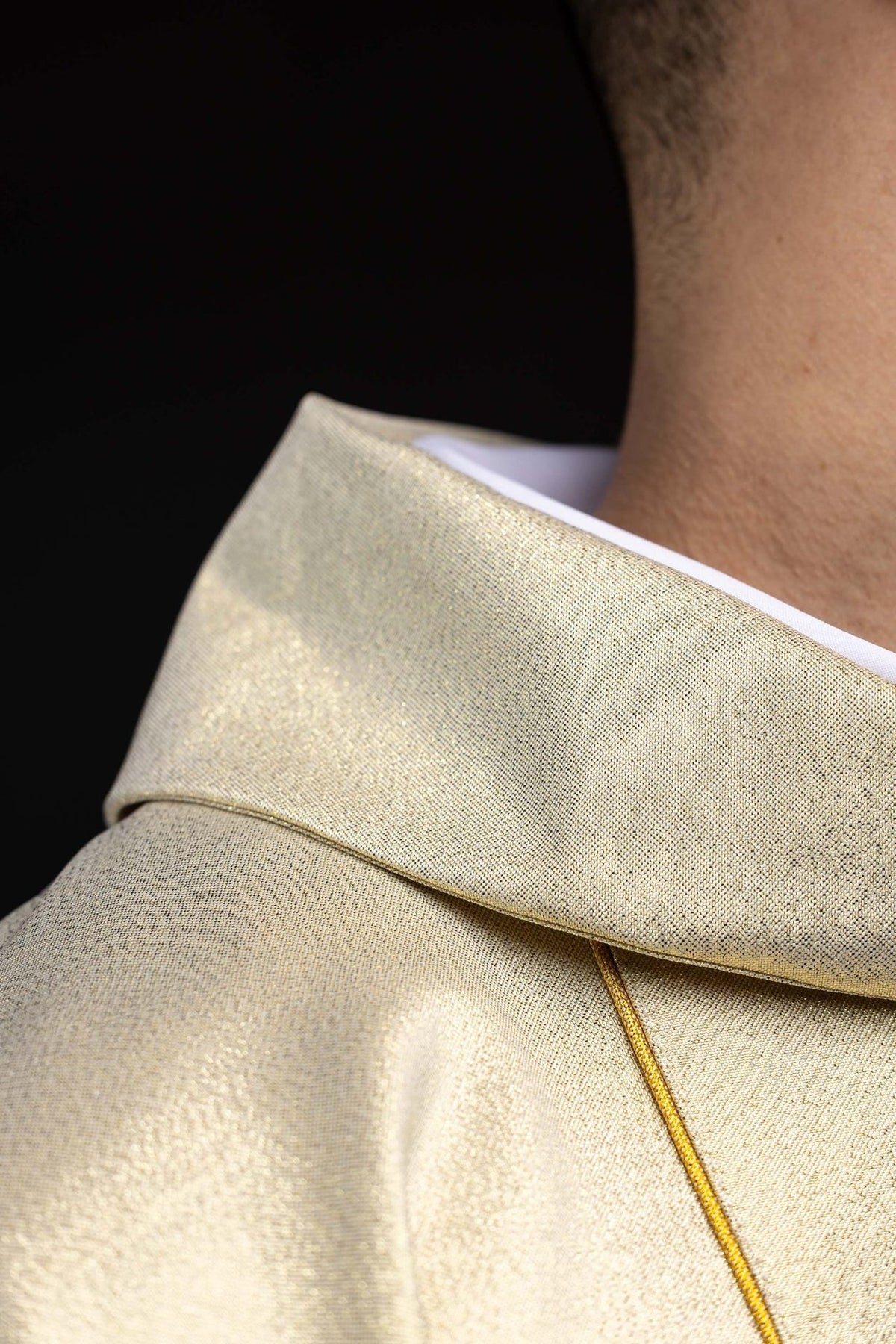 Gold chasuble close-up of stand-up collar and gold-edged fabric