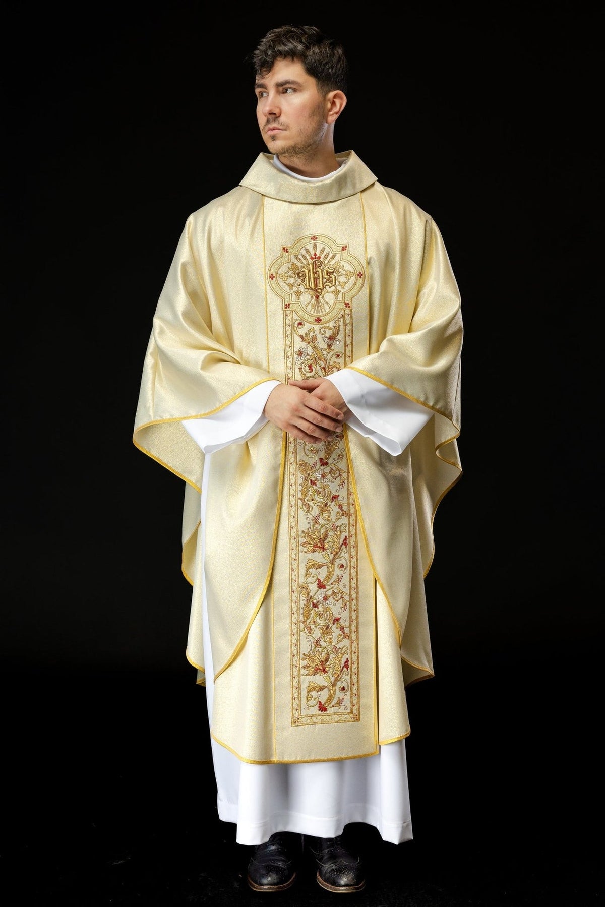 Gold chasuble front view showing the full embroidered floral orphrey and gold trim