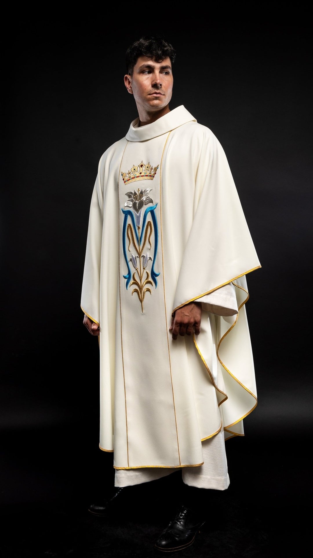 Ecru Marian chasuble side view with gold trim and embroidered front panel