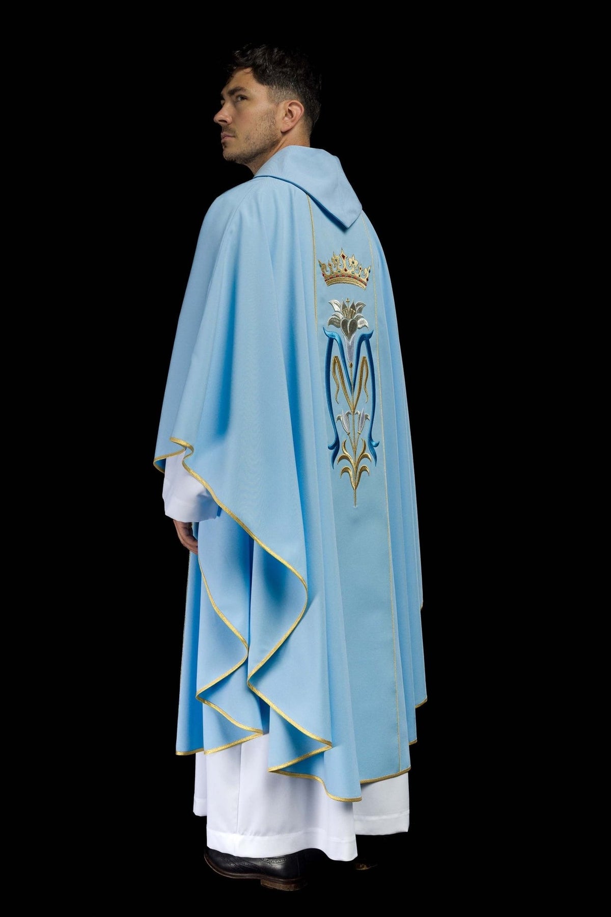 Blue Marian chasuble, side view showing flowing sleeves and gold trim