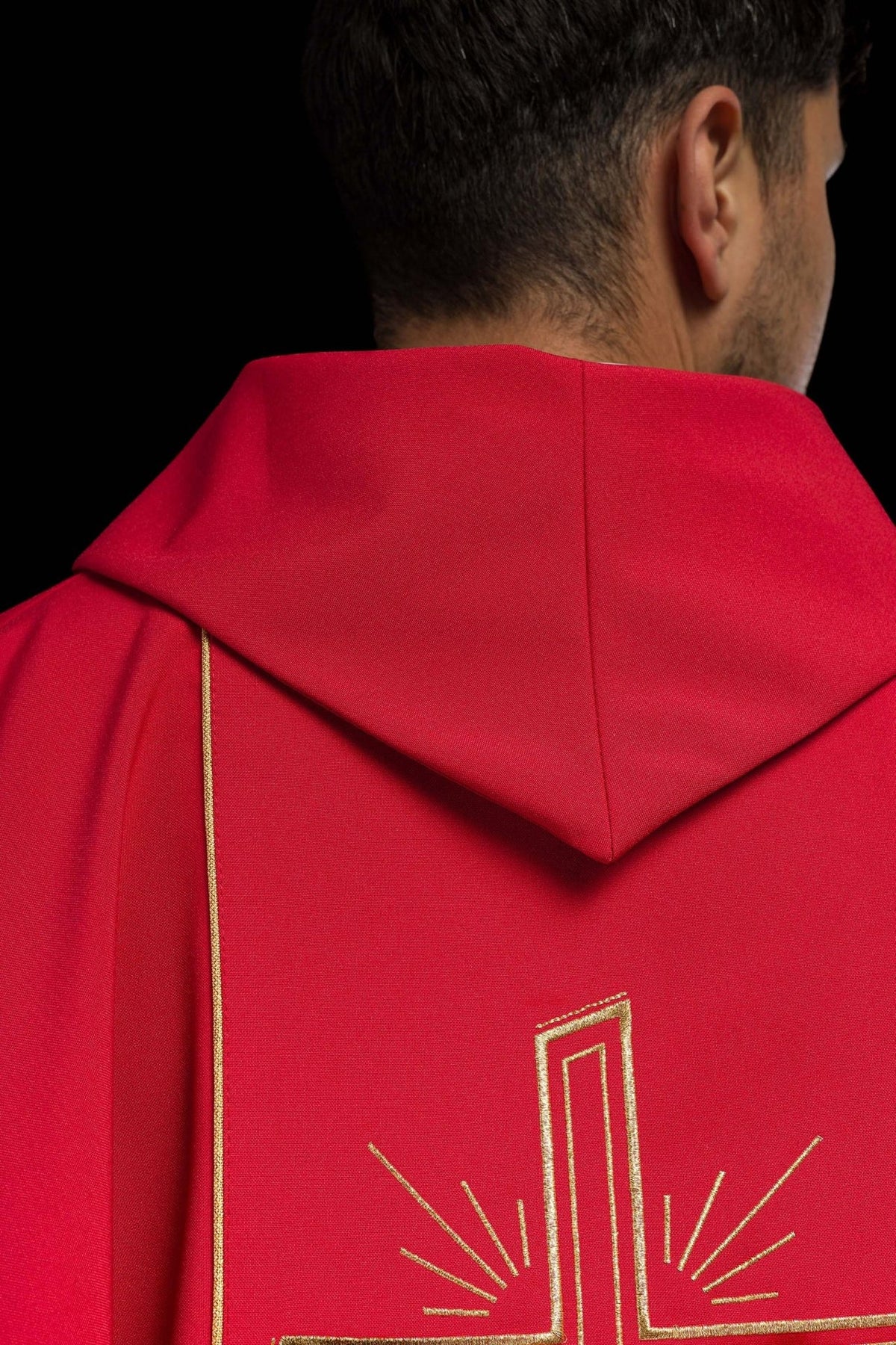 Red chasuble front detail with gold trim and stand-up collar