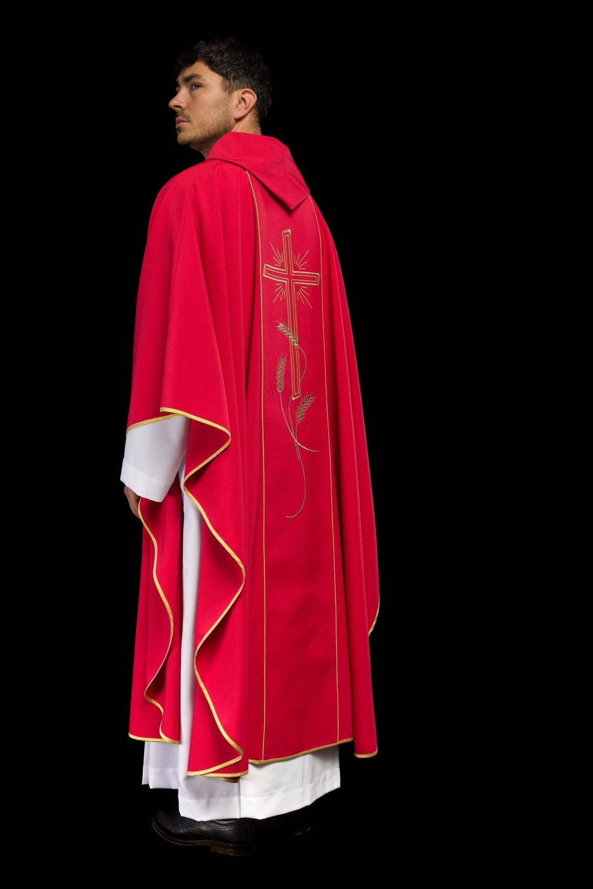 Red chasuble side view showing gold trim and back cross