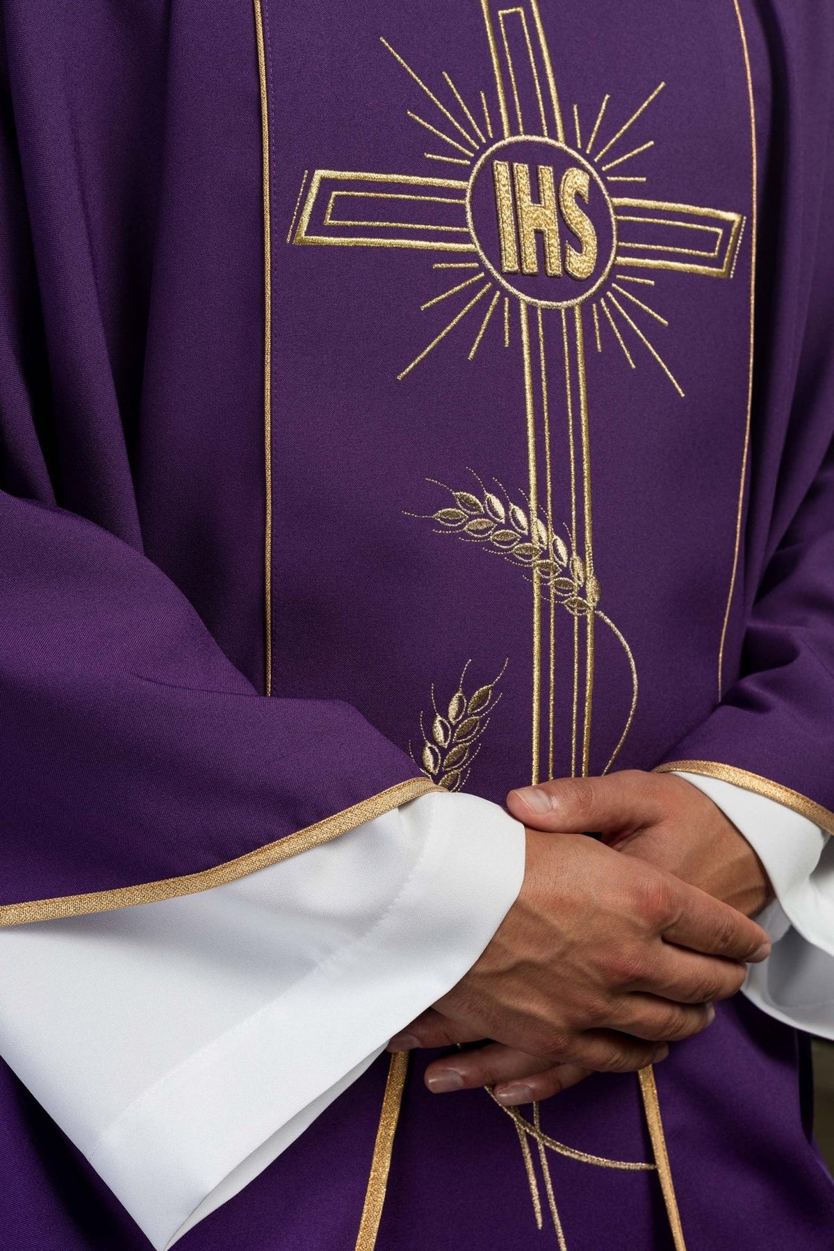 Purple chasuble detail of gold IHS cross, wheat embroidery and satin trim
