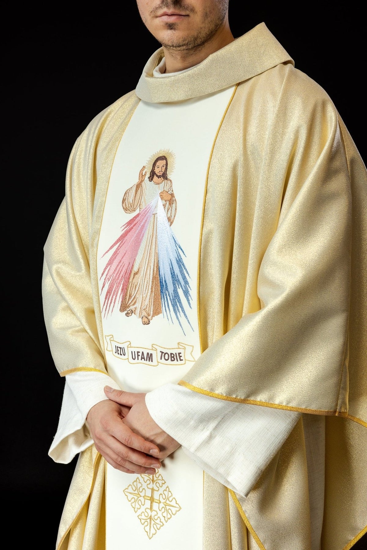 Gold chasuble close-up showing Divine Mercy embroidery, stand-up collar and gold trim