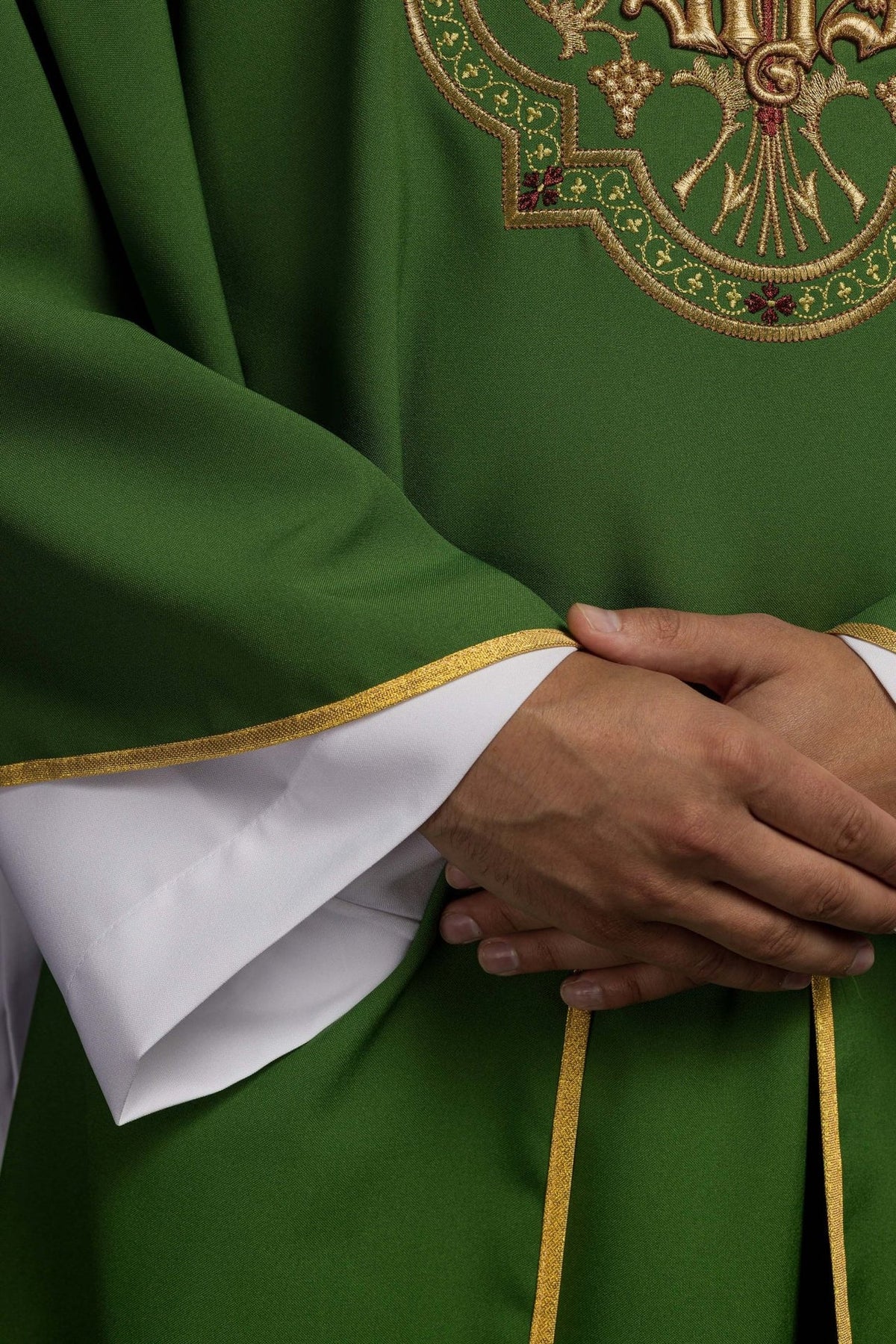 Green chasuble detail showing gold embroidery, grapes and wheat