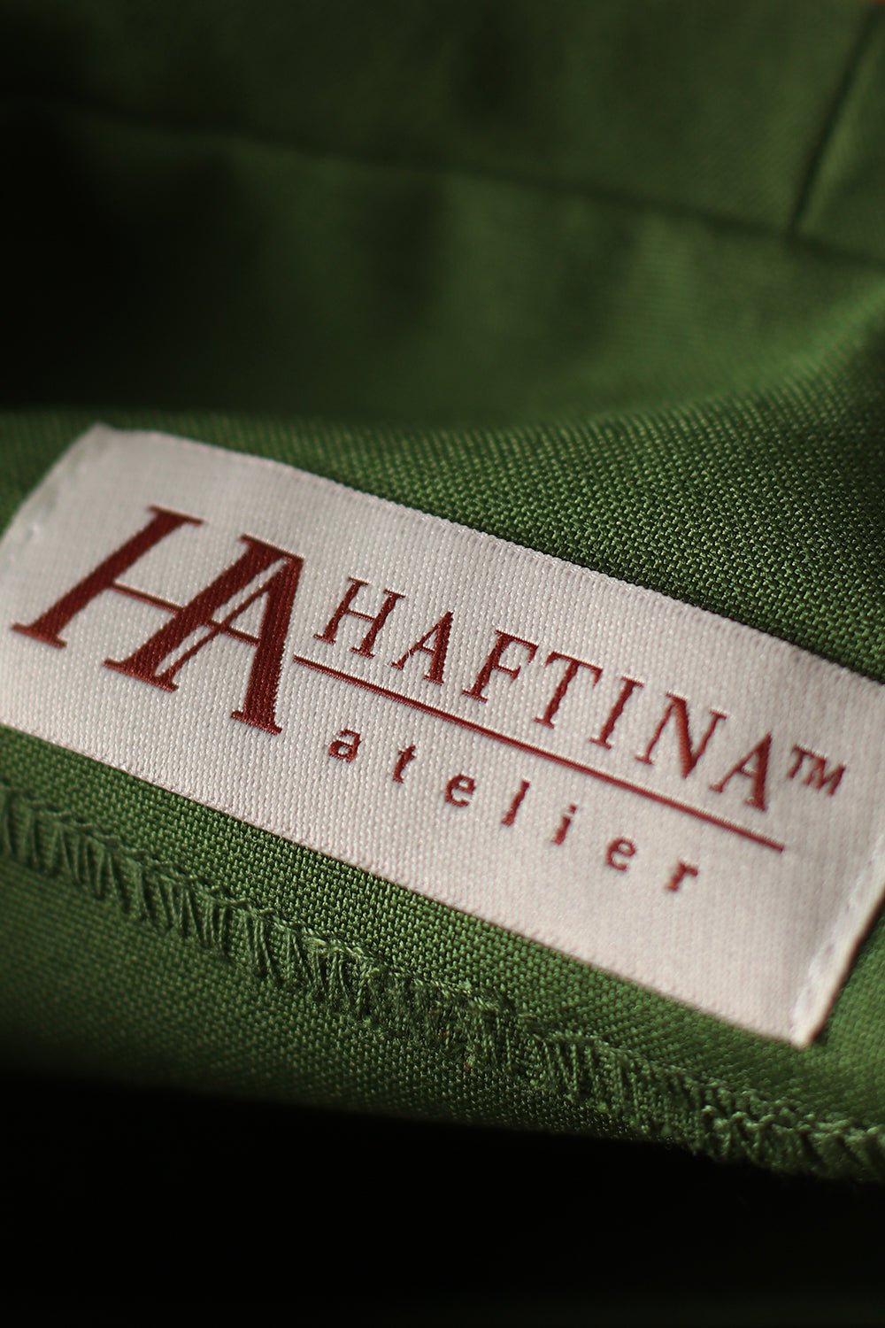 Green chasuble detail showing gold trim and green fabric