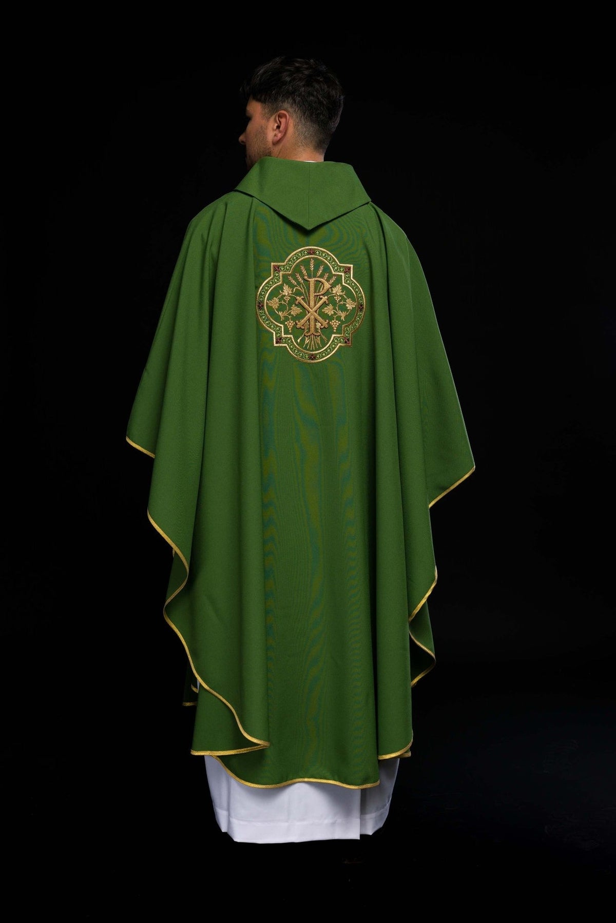 Green chasuble back view with gold PAX embroidery