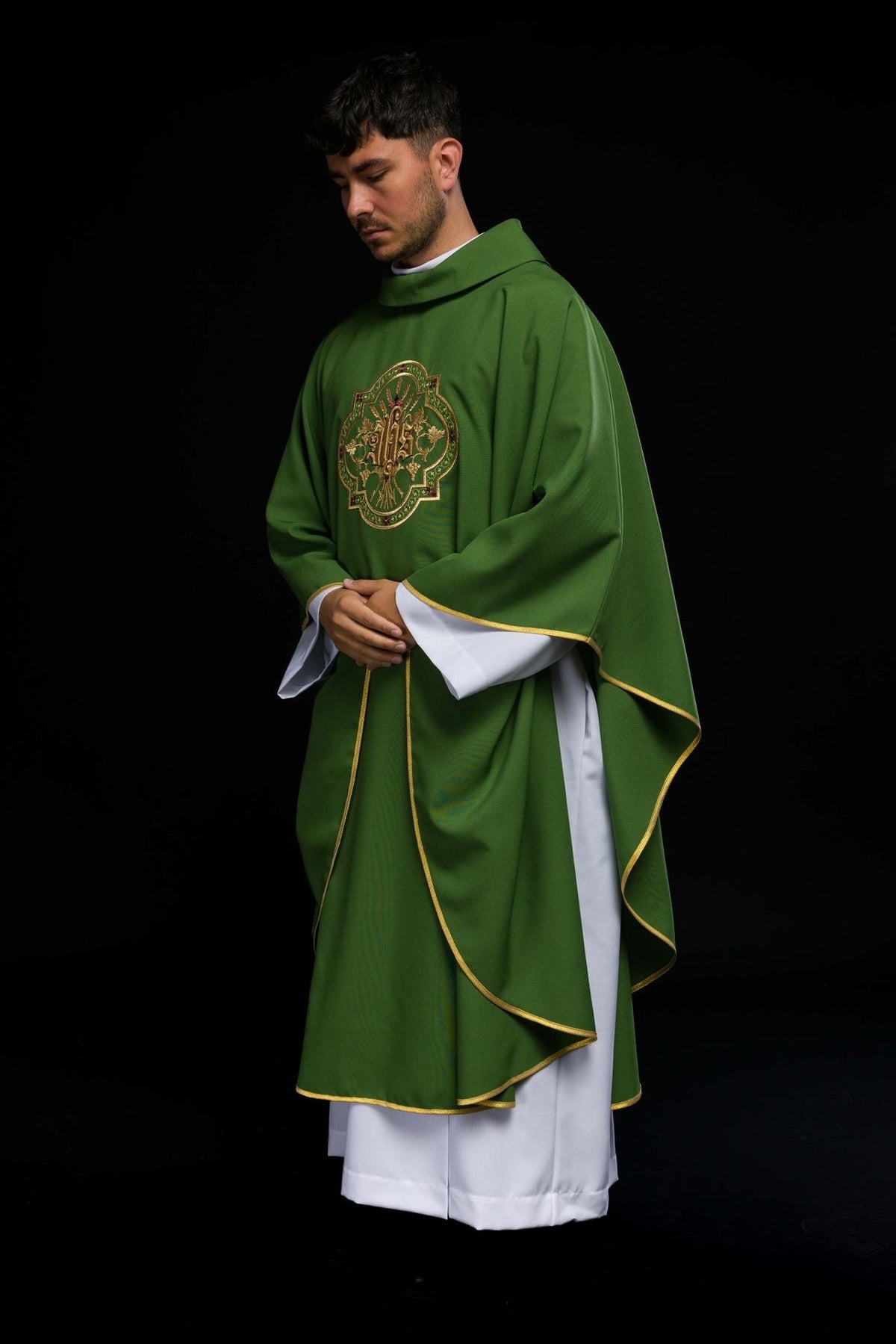 Green chasuble side view with gold trim and front embroidery