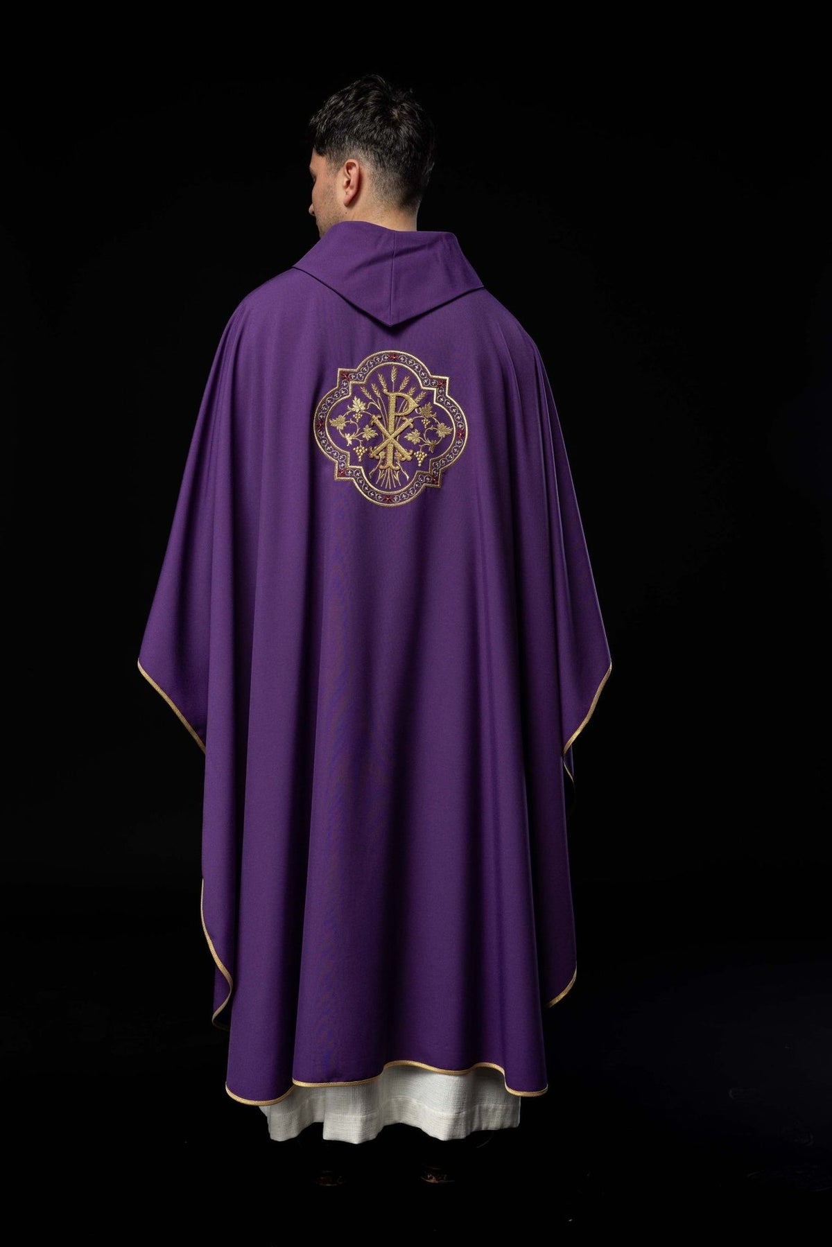 Purple chasuble full back view with gold trim and PAX embroidery