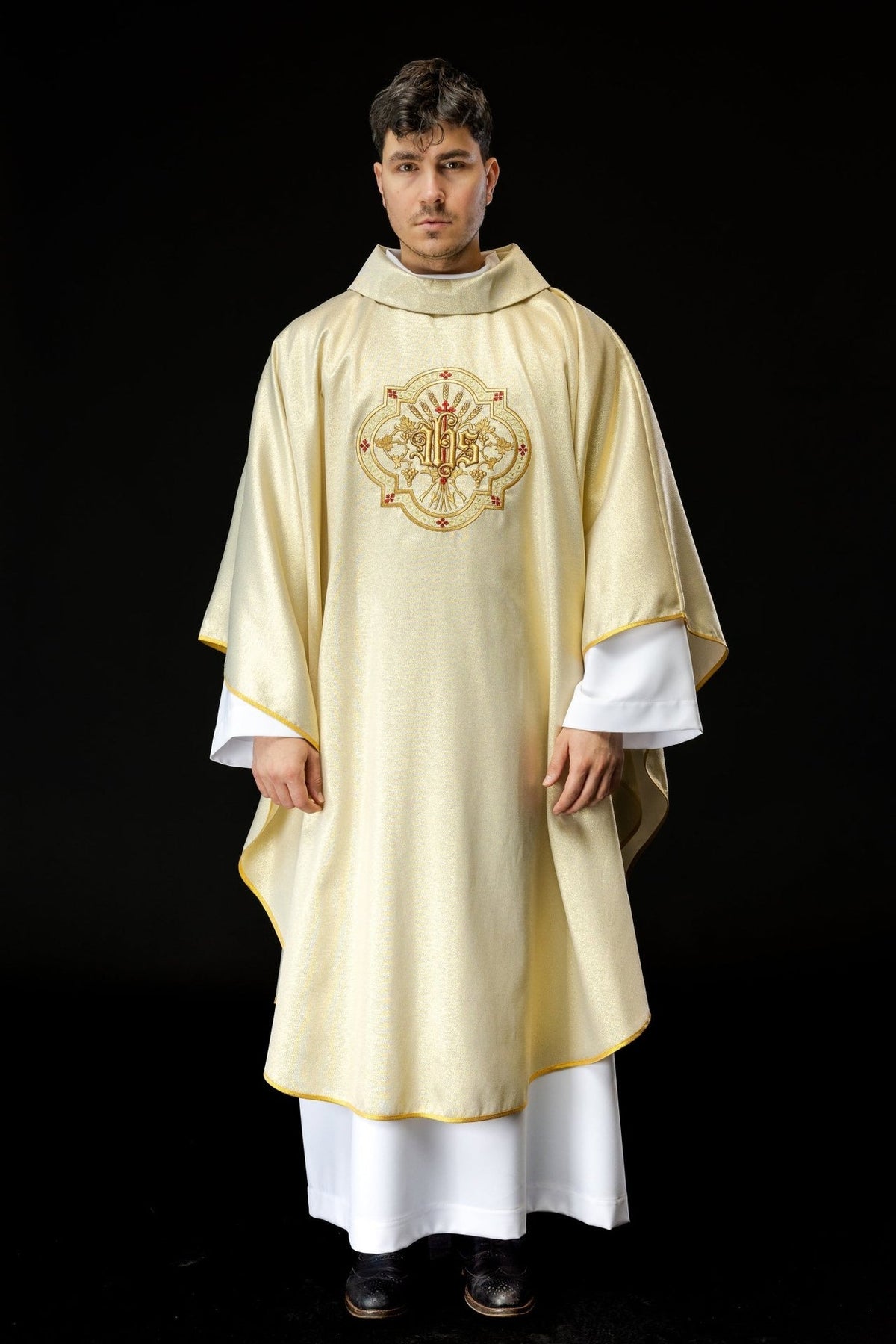 Gold chasuble front view with IHS embroidery, gold trim and stand-up collar