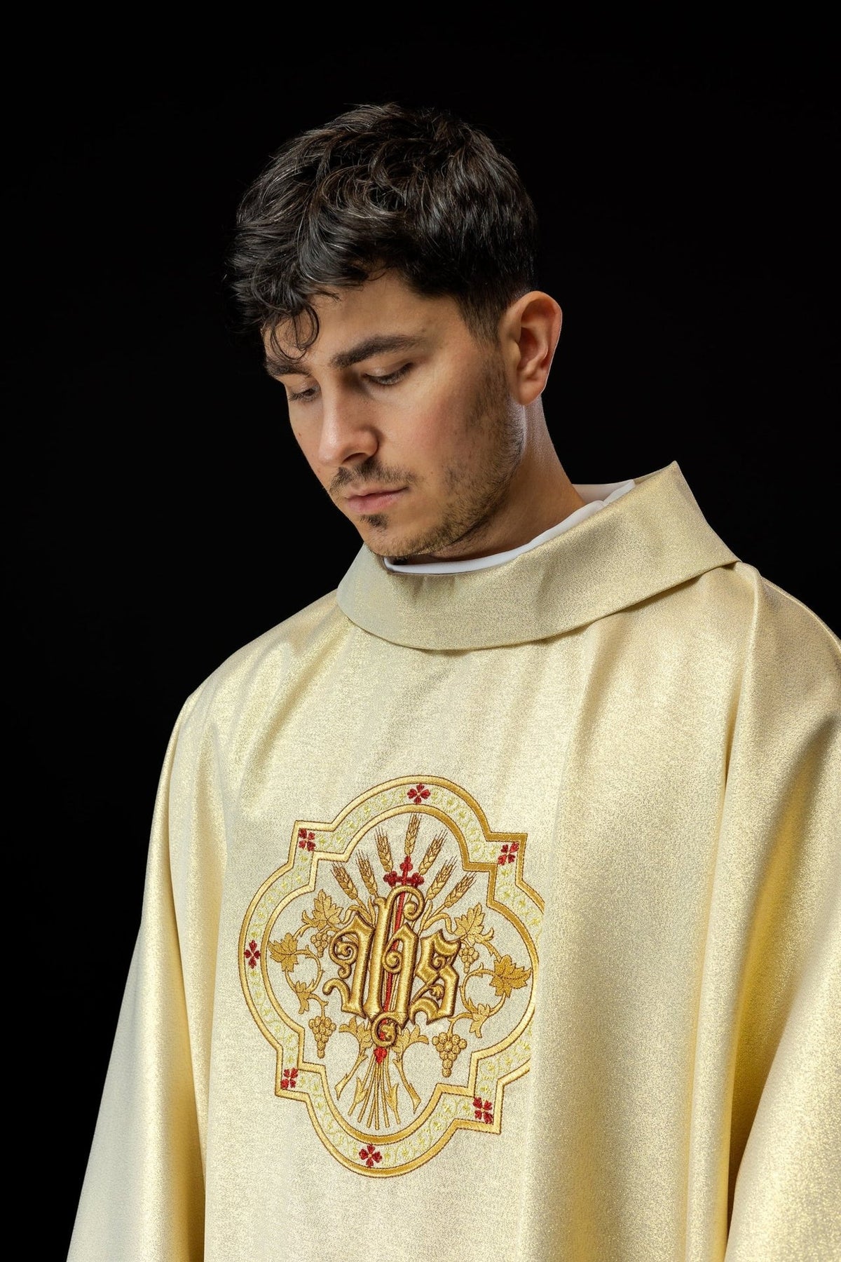 Gold chasuble front close-up with IHS embroidery, wheat, grapes and red accents