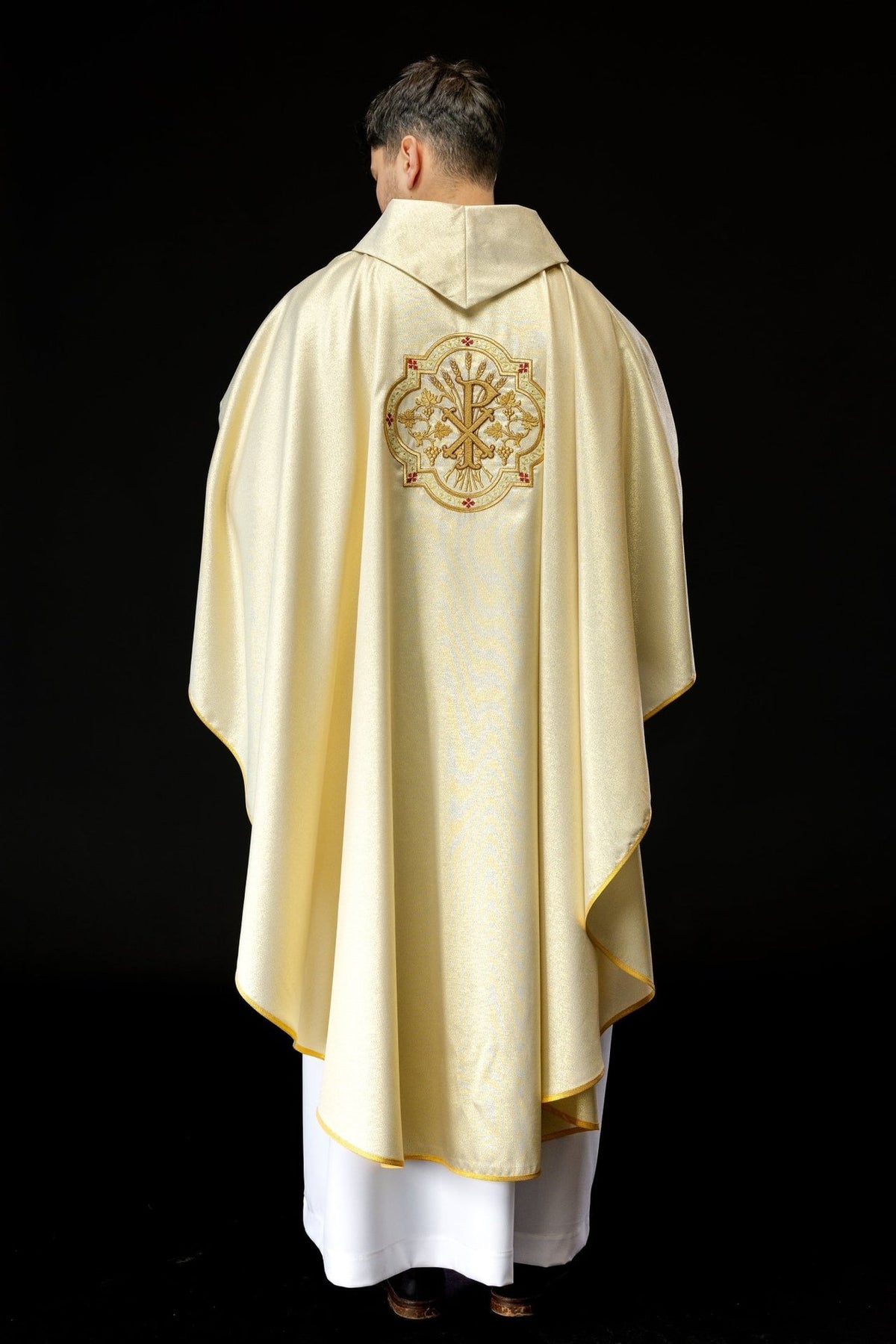 Gold chasuble full back view with PAX embroidery and gold trim