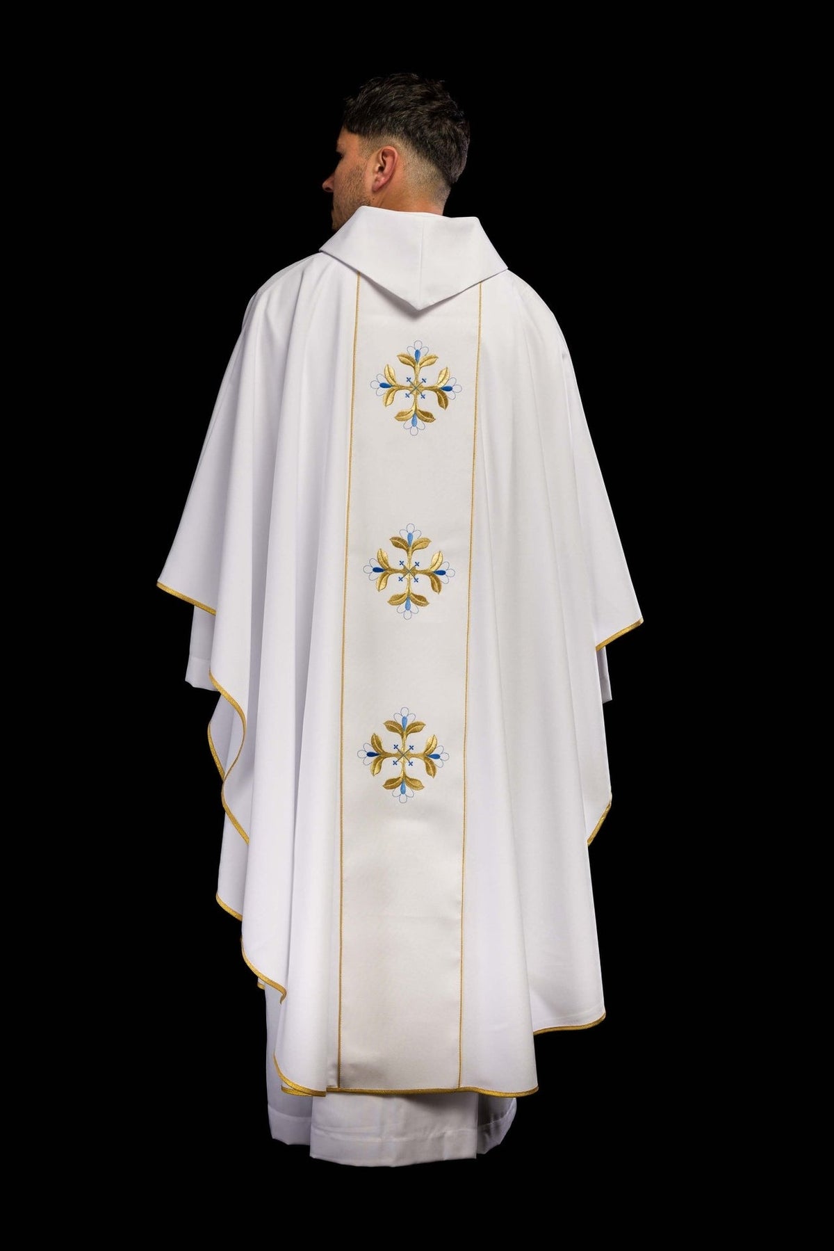 Marian chasuble back view with repeated blue and gold floral cross embroidery