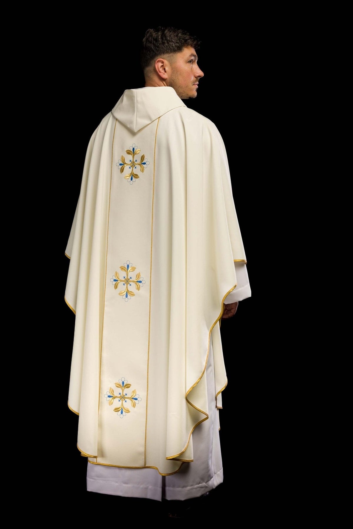 Marian chasuble back close-up showing embroidered blue and gold cross motif