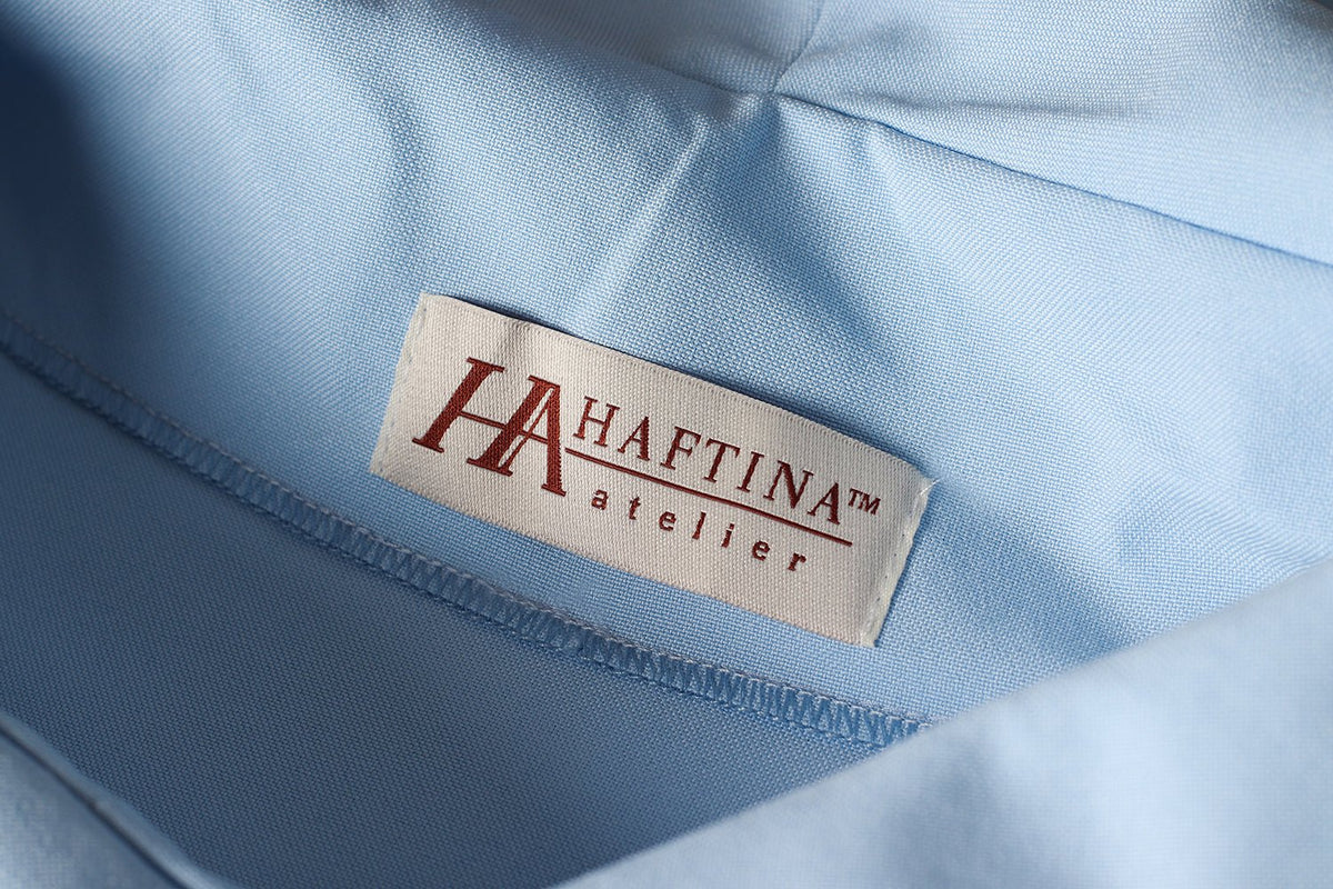 Blue chasuble fabric and inner label close-up