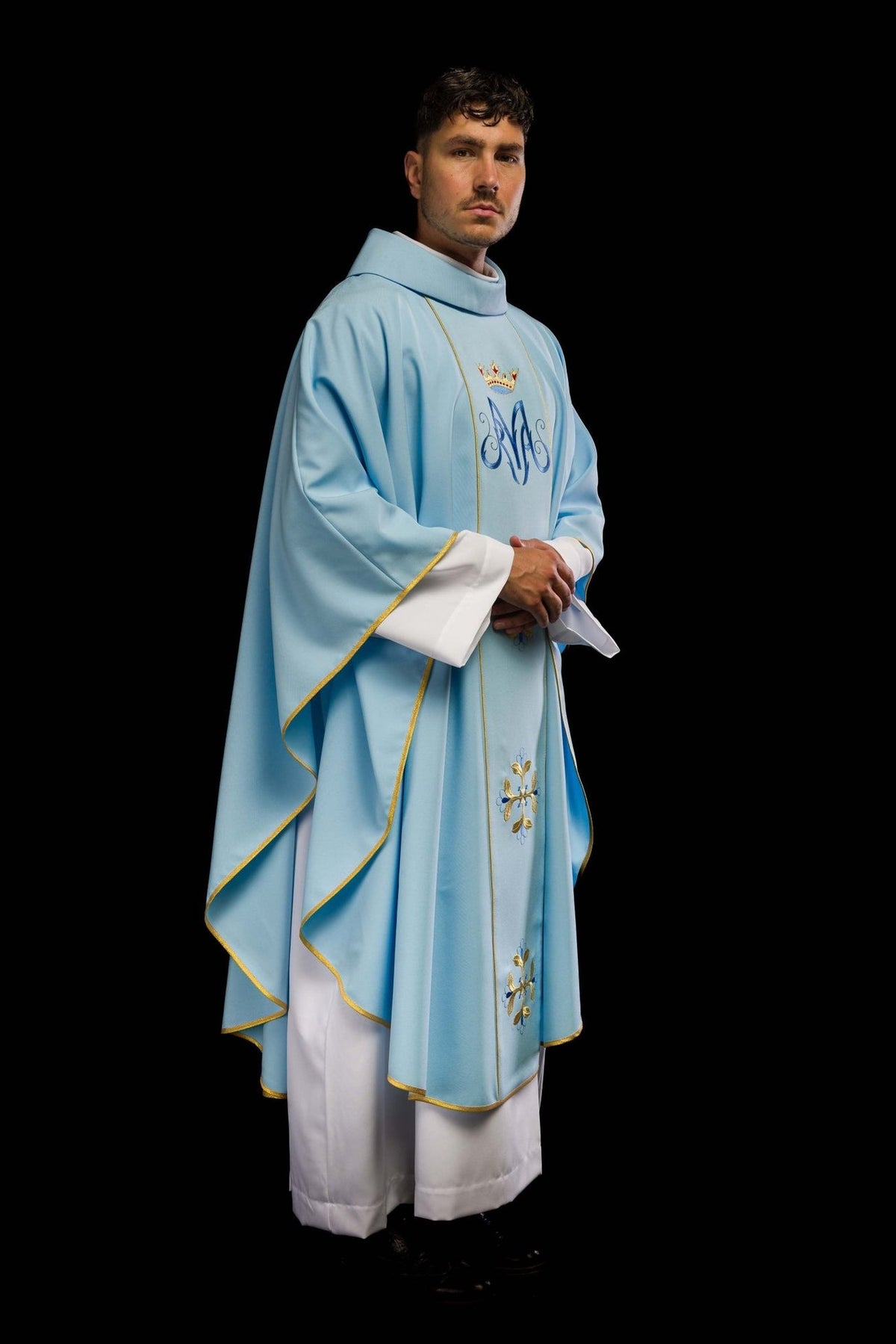 Blue chasuble side view with flowing panels and gold trim