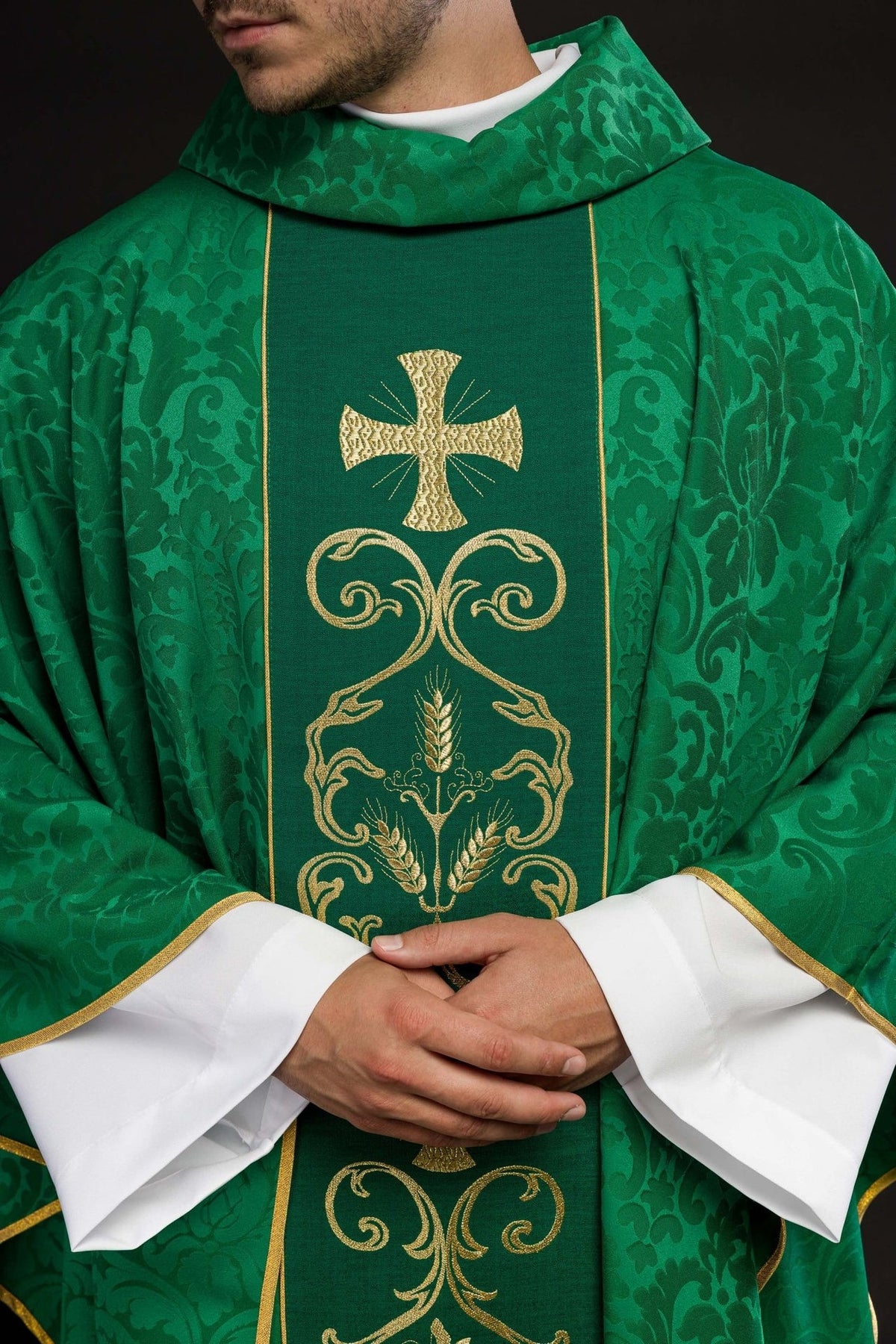 Green chasuble front close-up with gold embroidered cross, wheat and vine motifs