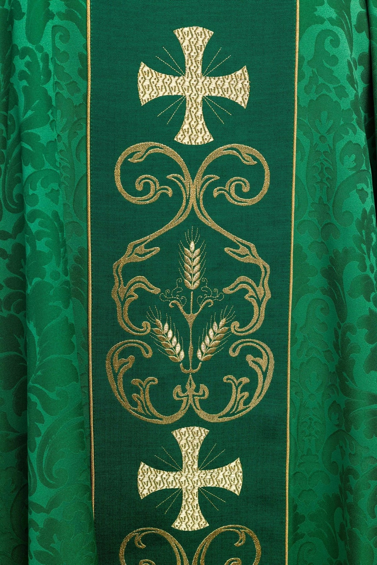 Embroidered orphrey close-up with gold cross, wheat and scrolling vine motifs
