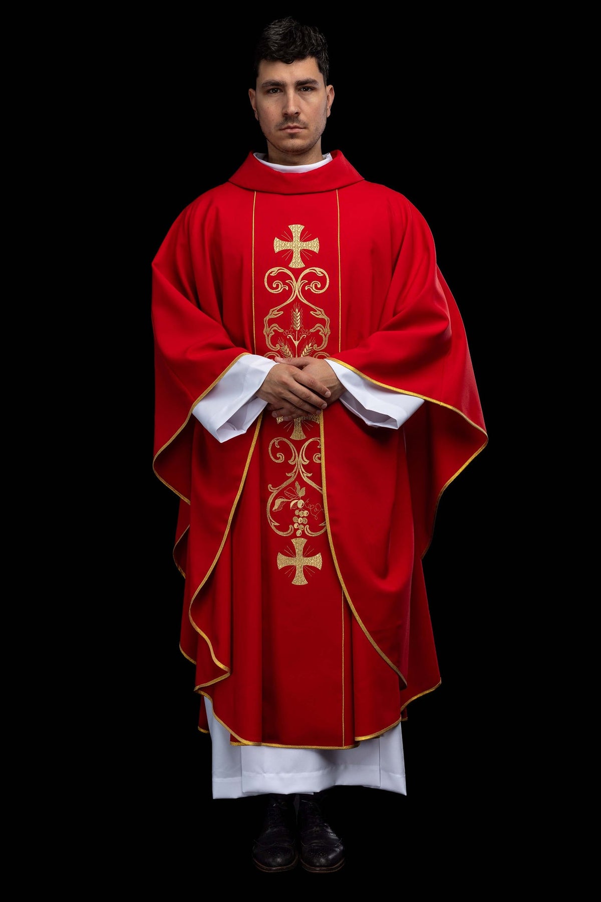 Red chasuble, front view showing gold trim and embroidered wheat and cross motifs