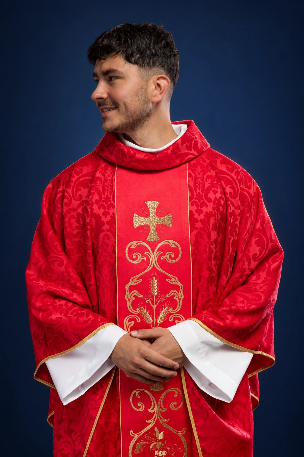 Red Liturgical Chasuble with Embroidered Orphrey, front worn view with gold cross and floral motifs