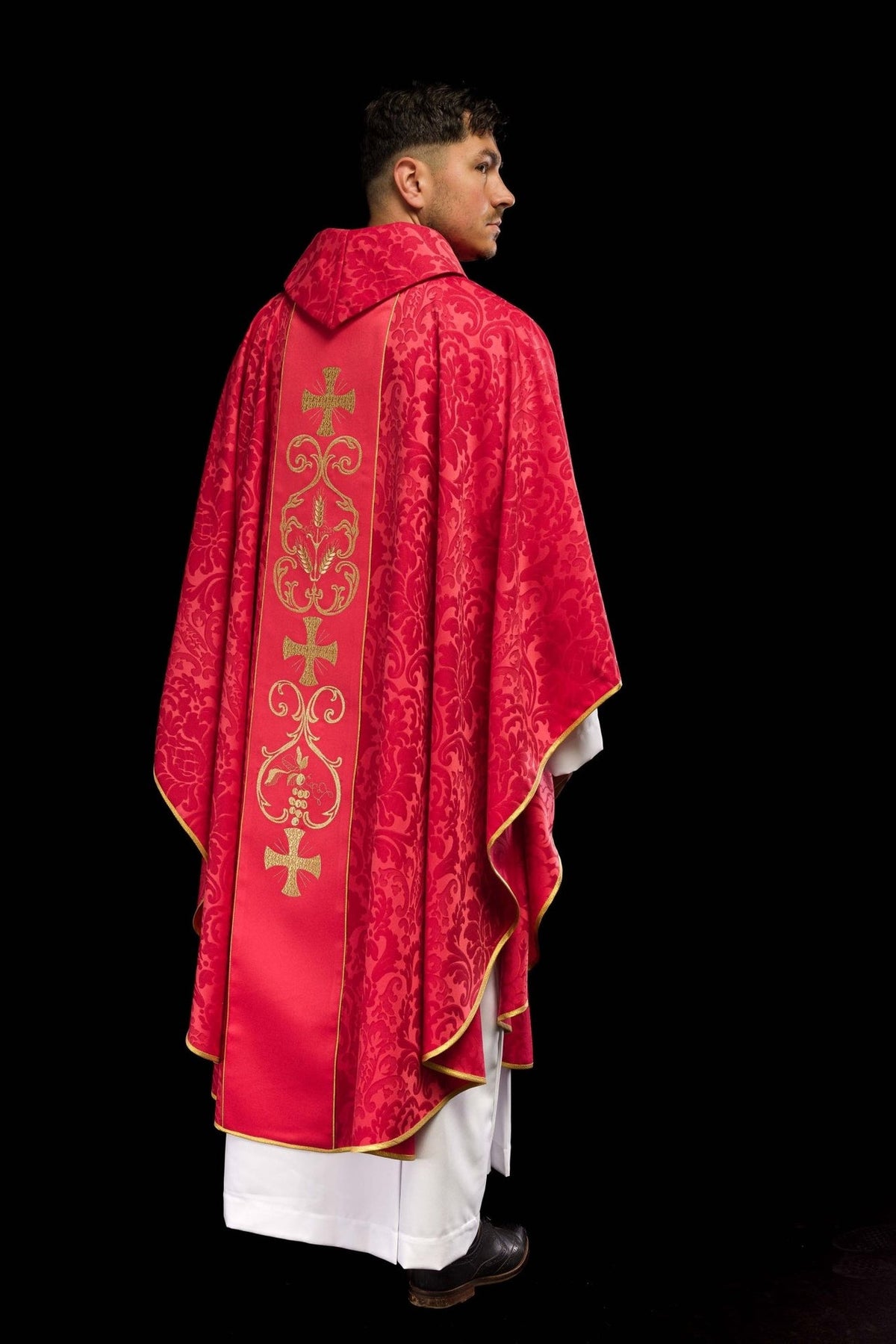Red chasuble back view with embroidered orphrey, gold crosses and floral jacquard fabric