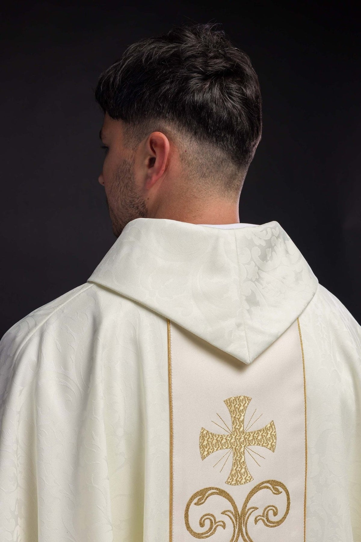 Liturgical chasuble label detail on ivory jacquard fabric