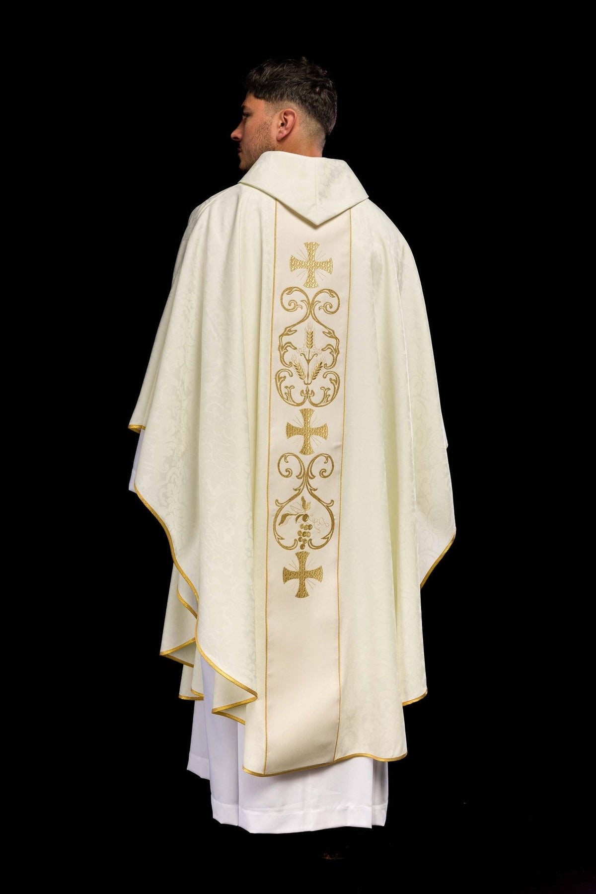 Liturgical chasuble back view showing full gold embroidered orphrey and ivory jacquard fabric