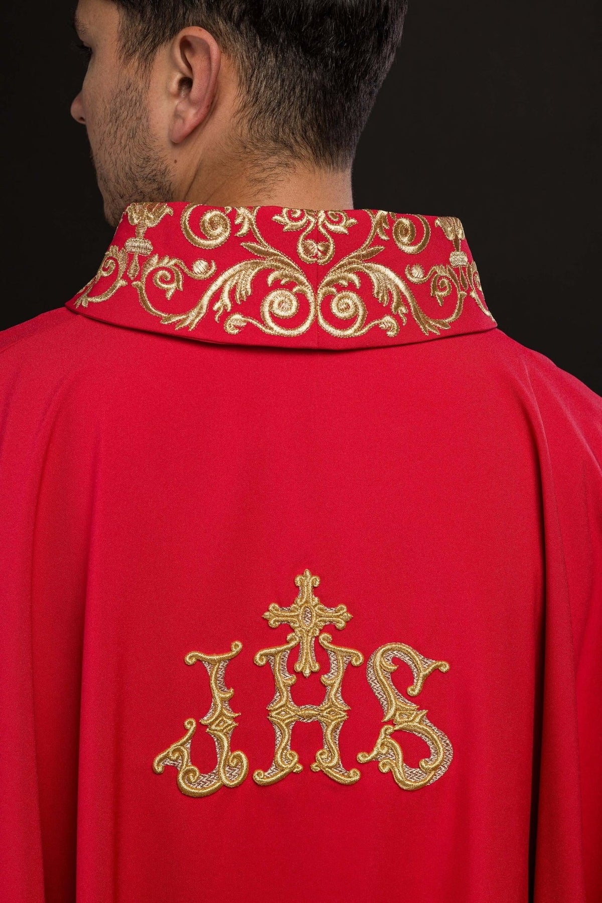 Red chasuble back collar close-up with gold decorative embroidery