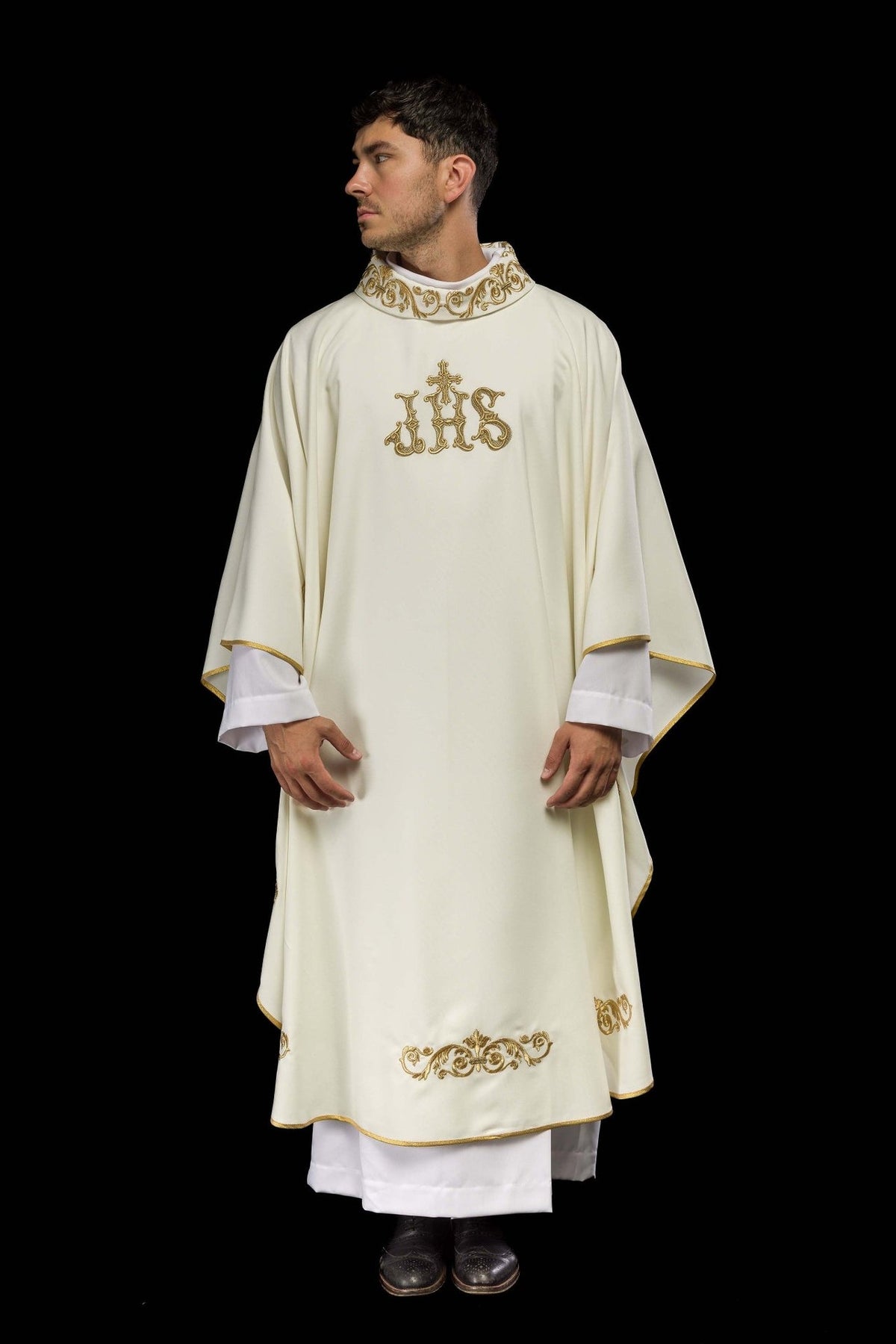 Ivory chasuble with gold IHS embroidery and decorative trim, full front view