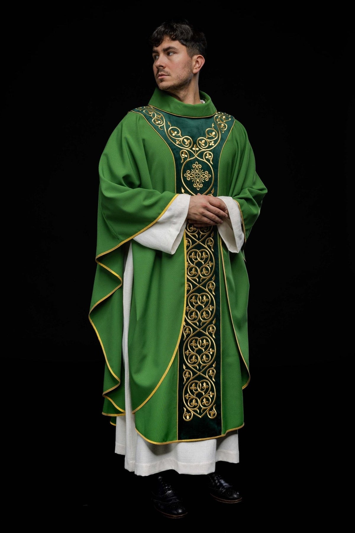 Green chasuble, angled front view with gold embroidery and trim