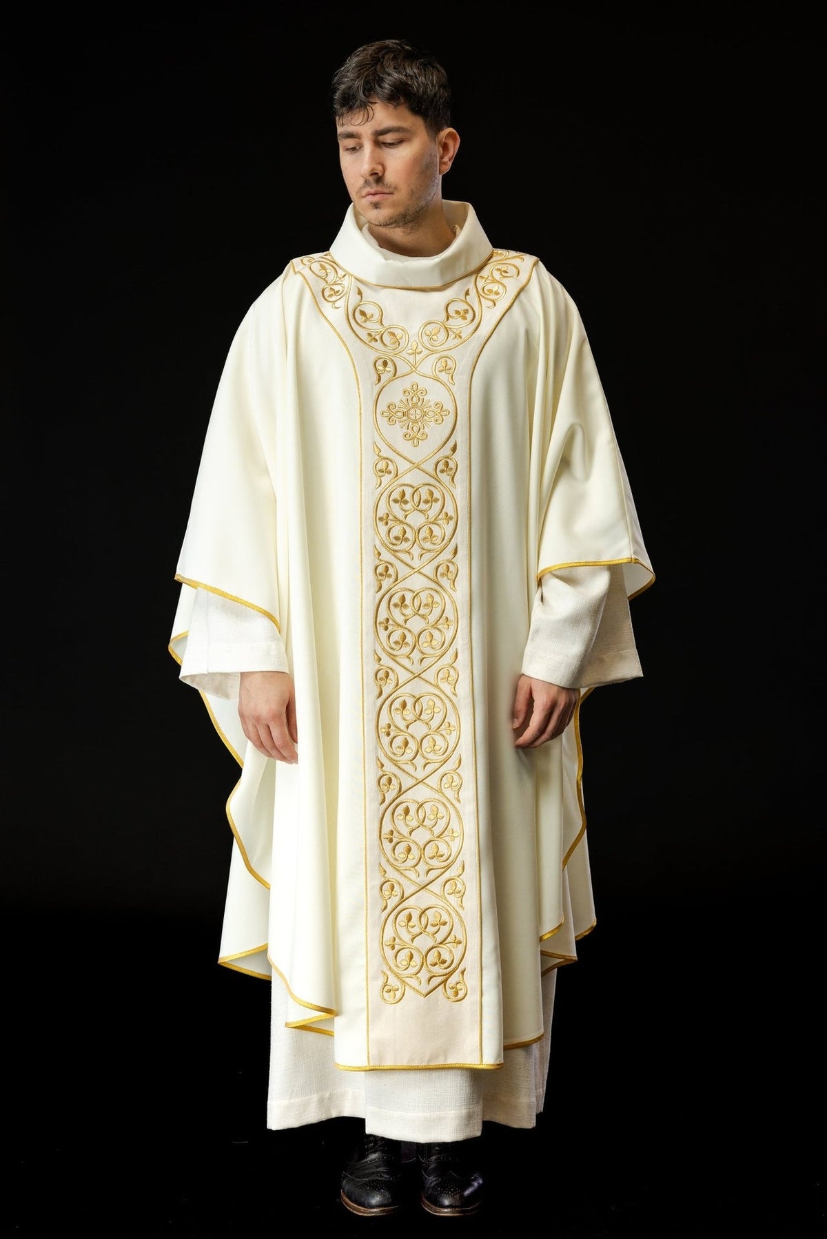 Liturgical chasuble, full front view in ivory with ornate gold embroidered orphrey