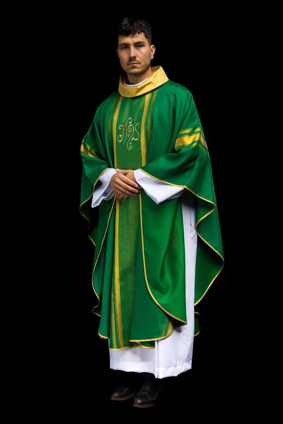 Green chasuble three-quarter front view with gold trim and IHS embroidery