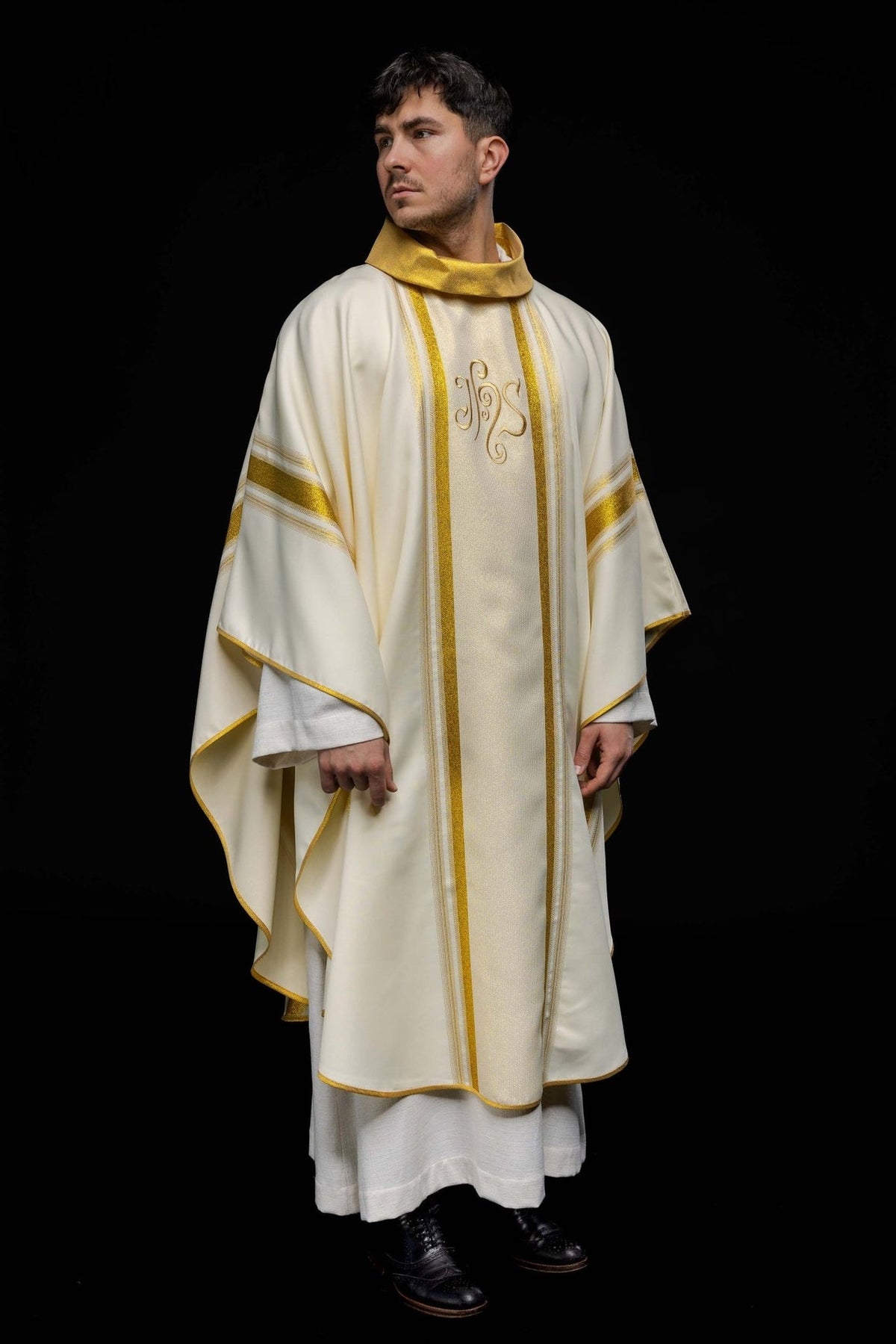 Chasuble front worn view showing ivory fabric, gold trim and IHS embroidery