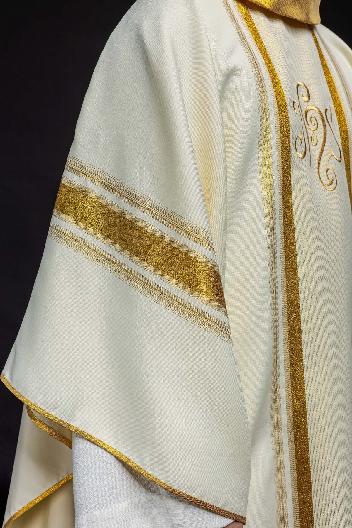 Chasuble close-up showing gold stand-up collar and vertical trim