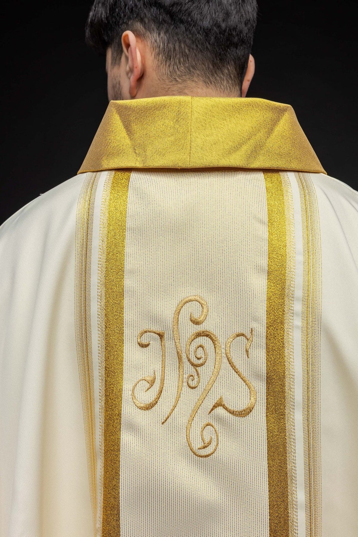 Chasuble sleeve detail with broad gold trim and narrow gold edging