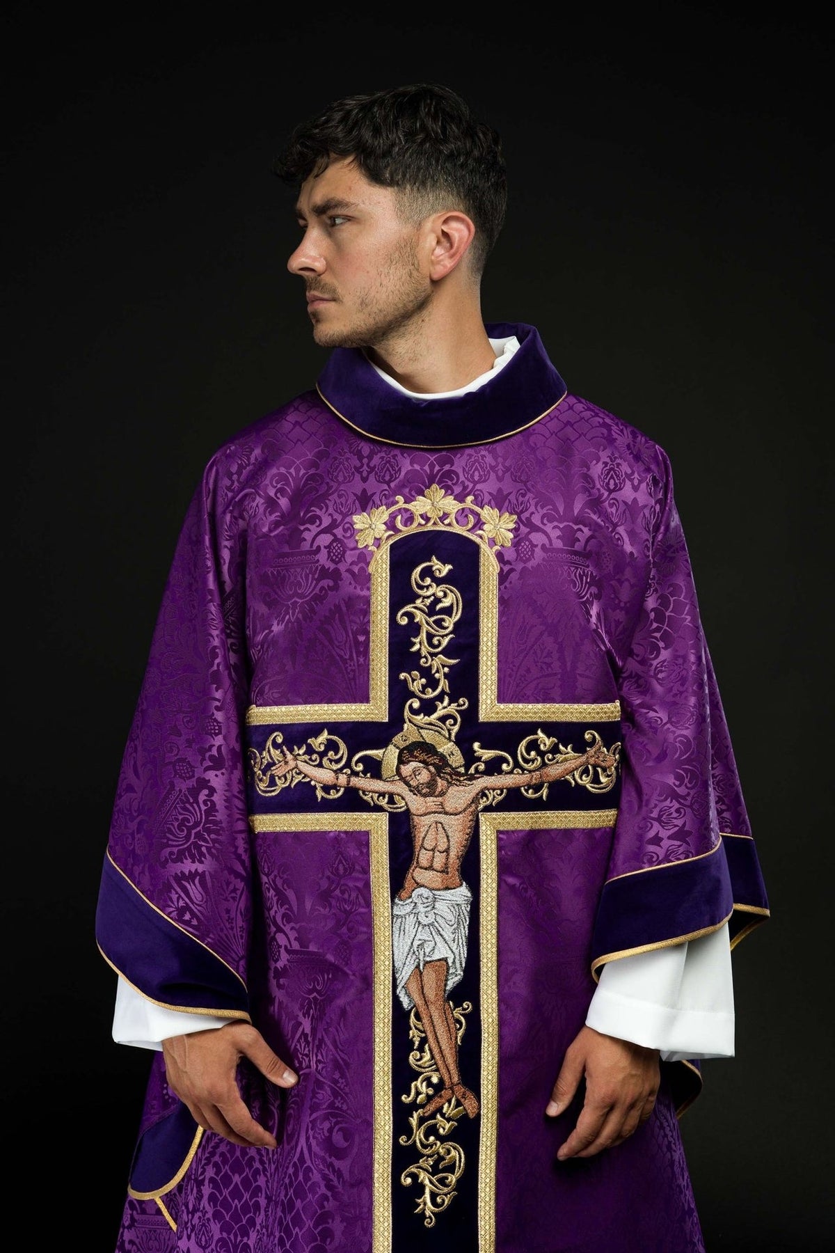 Purple chasuble, upper front view with embroidered Jesus Christ image and gold trim